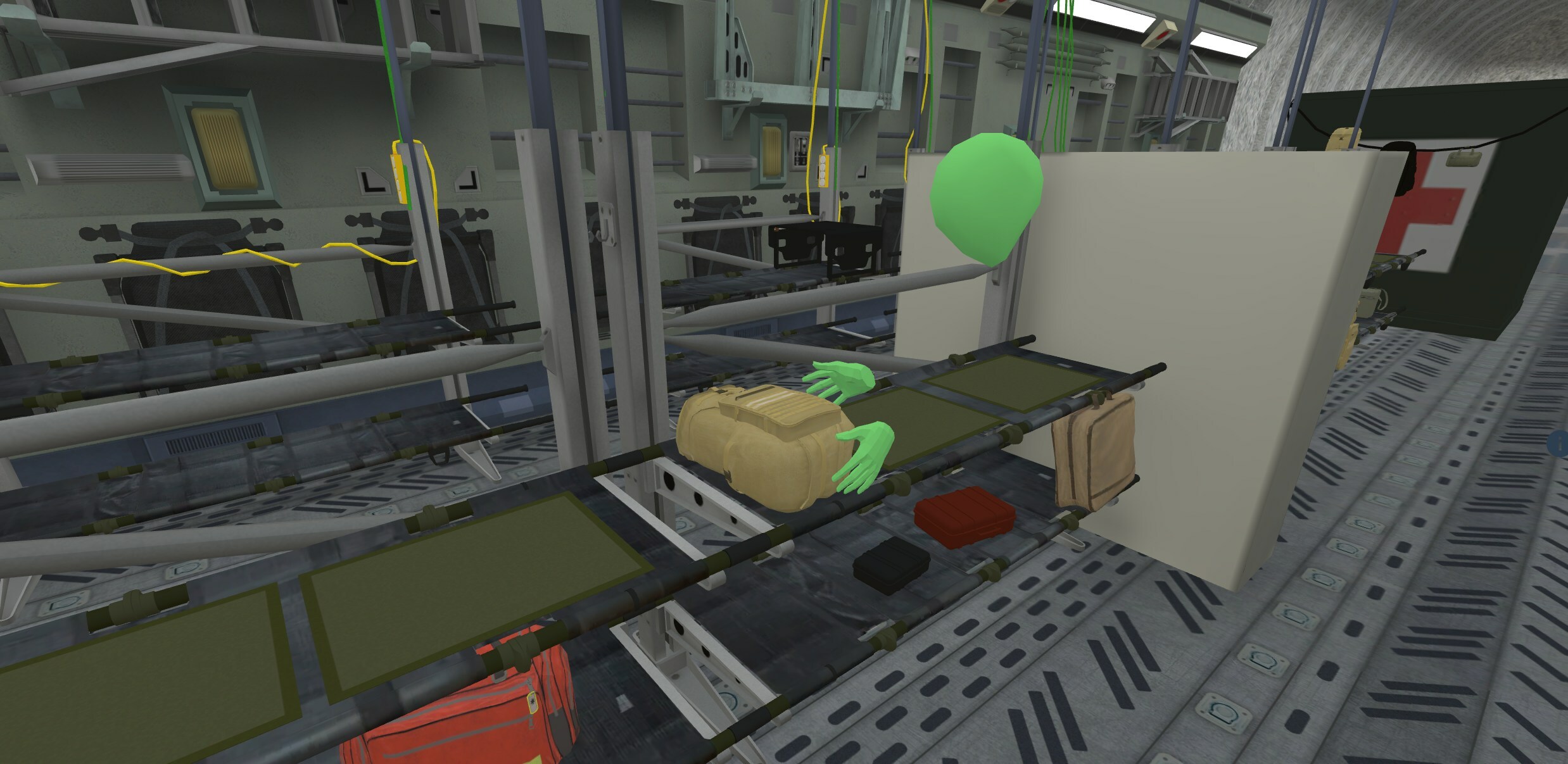 Figure 1. Example CCATT environment within the SimX VRMSS. Depicted is a learner accessing a stowed medical equipment kit in a digitally recreated C-17 aeromedical evacuation aircraft. (Photo by SimX, Inc.)