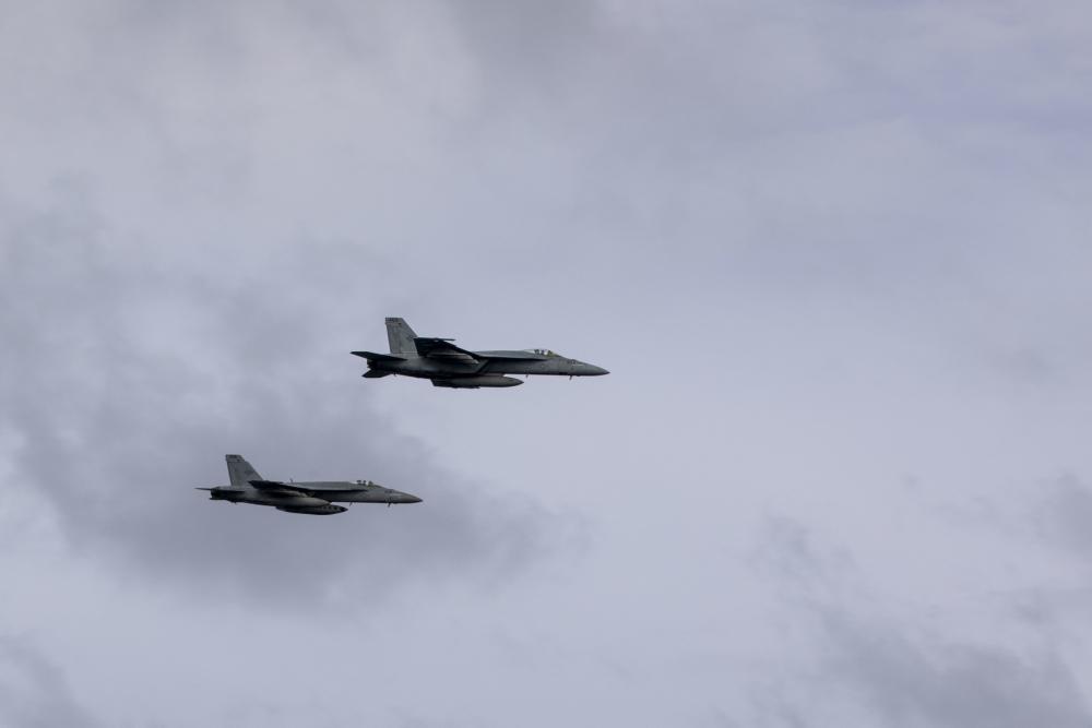 US Navy F/A-18E Super Hornets perform a fly-by