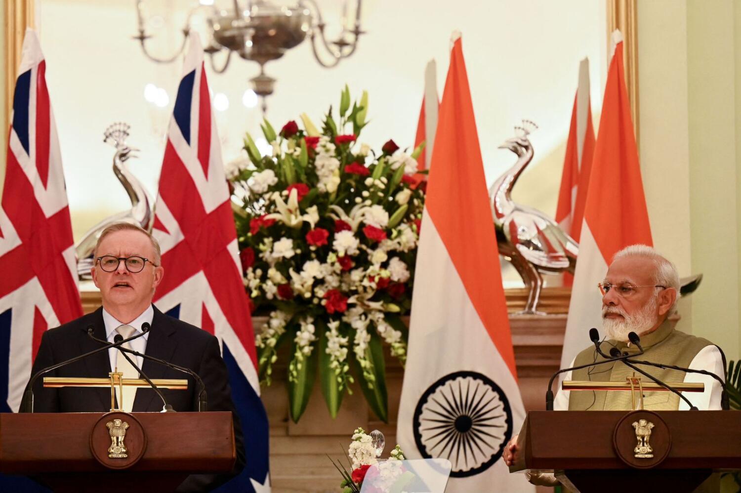Indian Prime Minister Narendra Modi looks on as Australia's Prime Minister Anthony Albanese speaks during a joint media briefing