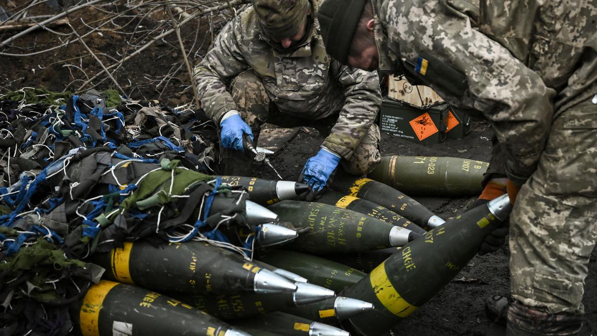 Ukrainian servicemen prepare to fire towards Russian positions with a 155mm M777 Howitzer artillery weapon on the front line somewhere near the city of Bakhmut