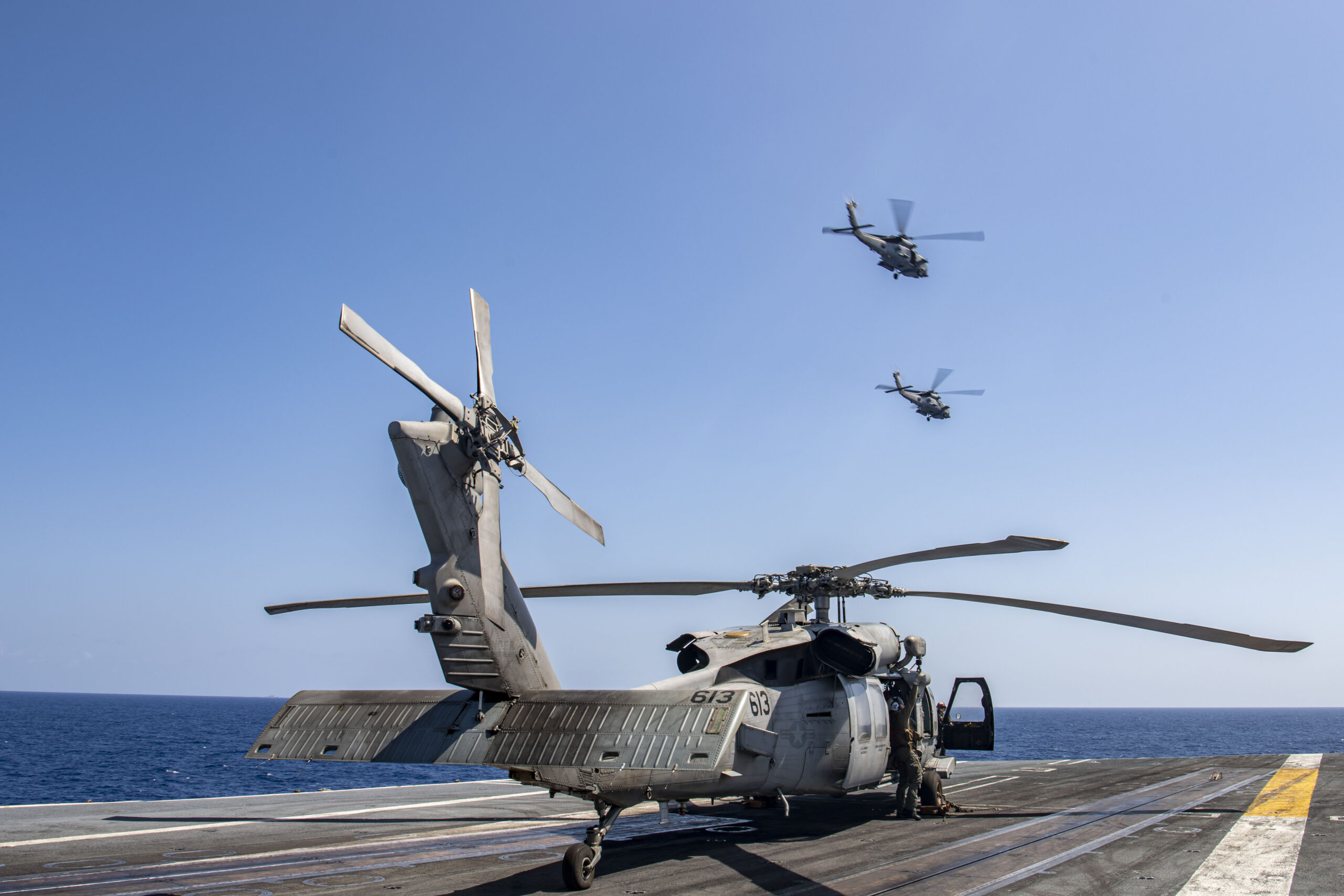230512-N-BI507-1130 PHILIPPINE SEA (May 12, 2022) Two MH-60R Sea Hawk helicopters from the 
