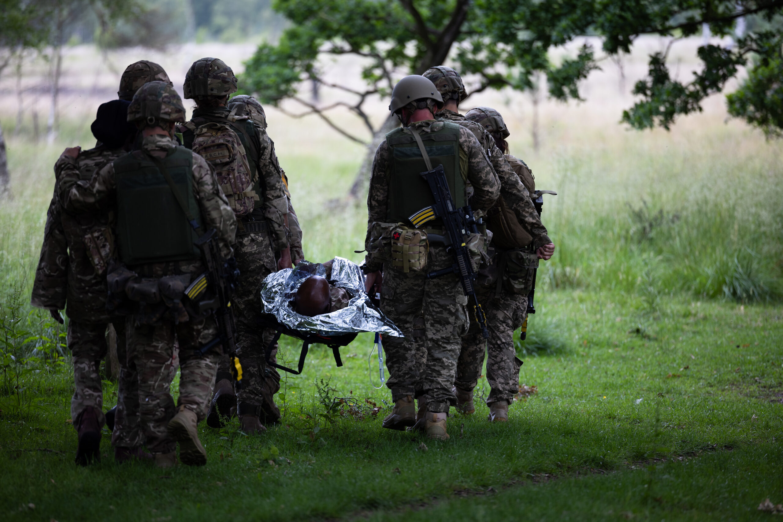 Members of the Armed Forces of Ukraine are learning vital life-saving battlefield skills in the first combat medical training course of its kind to be delivered by the British Army and its international partners. The five-week course, which began on the 29 May, has seen both current and new Ukrainian Armed Forces medics being trained in critical techniques such as providing medical care under fire, controlling heavy blood loss, and giving crucial pre-hospital emergency care. Evidence from the battlefield and requests from Ukrainian personnel have been incorporated into the programme, with trainees being instructed on how best to optimise their own health so they are fit to fight. The trainees go on to put their learning to the test in practice battlefield scenarios to give them the confidence to effectively apply their skills back on the front line. These include:  triaging mass casualties with a range of different injuries  treating casualties with major injuries caused by blasts and small arms fire  treating and safely extracting patients from civilian and military vehicles  extracting casualties under fire In their final days of training, Ukrainian personnel will learn how to teach life-saving battlefield first aid to other members of the Ukrainian Armed Forces when they return to the front line.