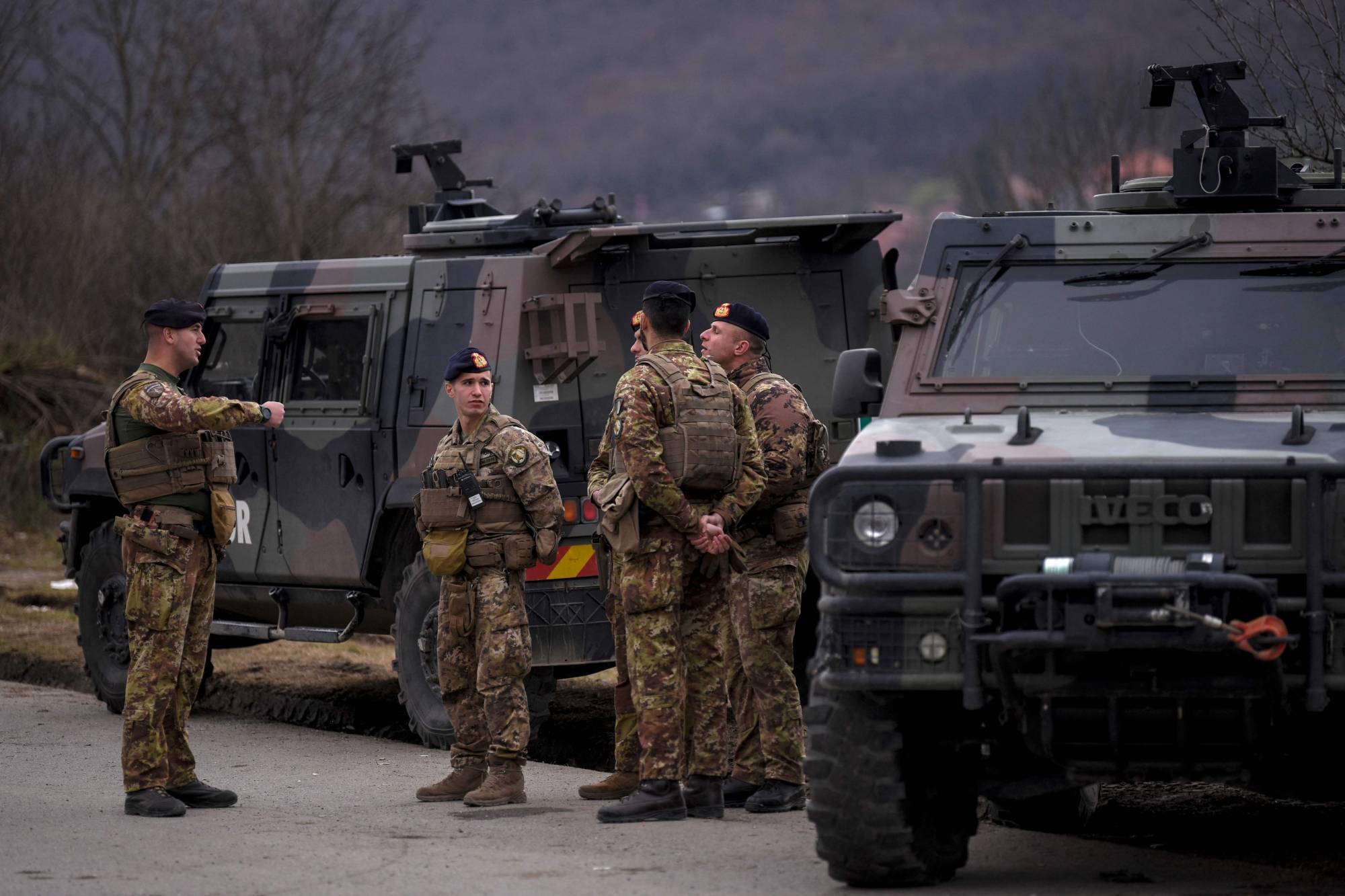 NATO peacekeeping soldiers patrol near the town of Zvecan in Kosovo
