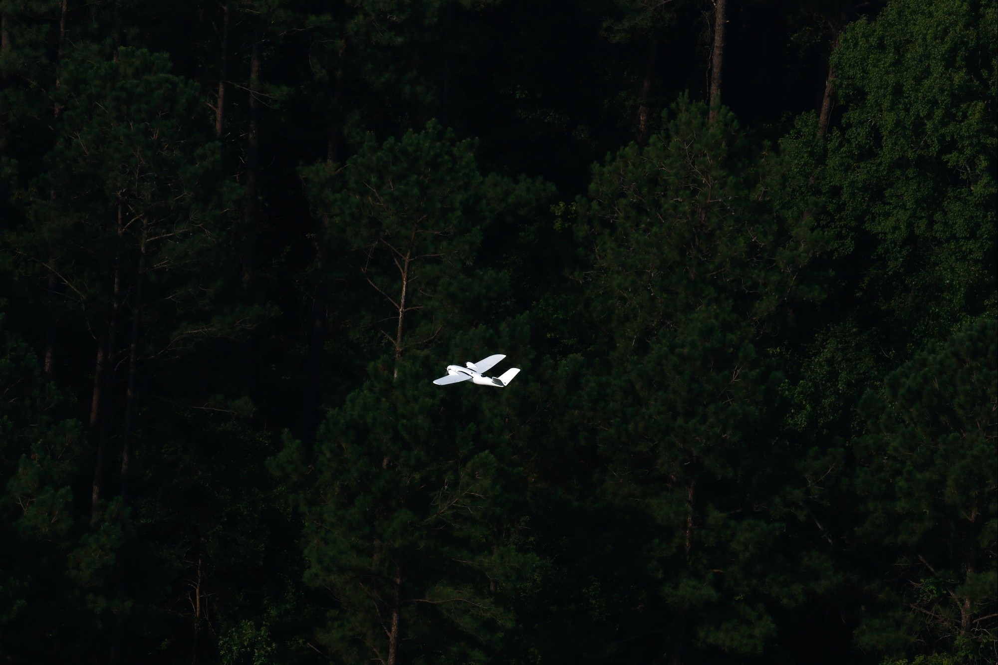 A drone piloted by MITRE in support of CARPE Dronvm testing flies over a testing area in South Carolina. U.S. Army Central tested CARPE Dronvm at McEntire JNGB and Poinsett Weapons Range, S.C., on July 18, 2023. (U.S. Army photo by Sgt. Amber Cobena)