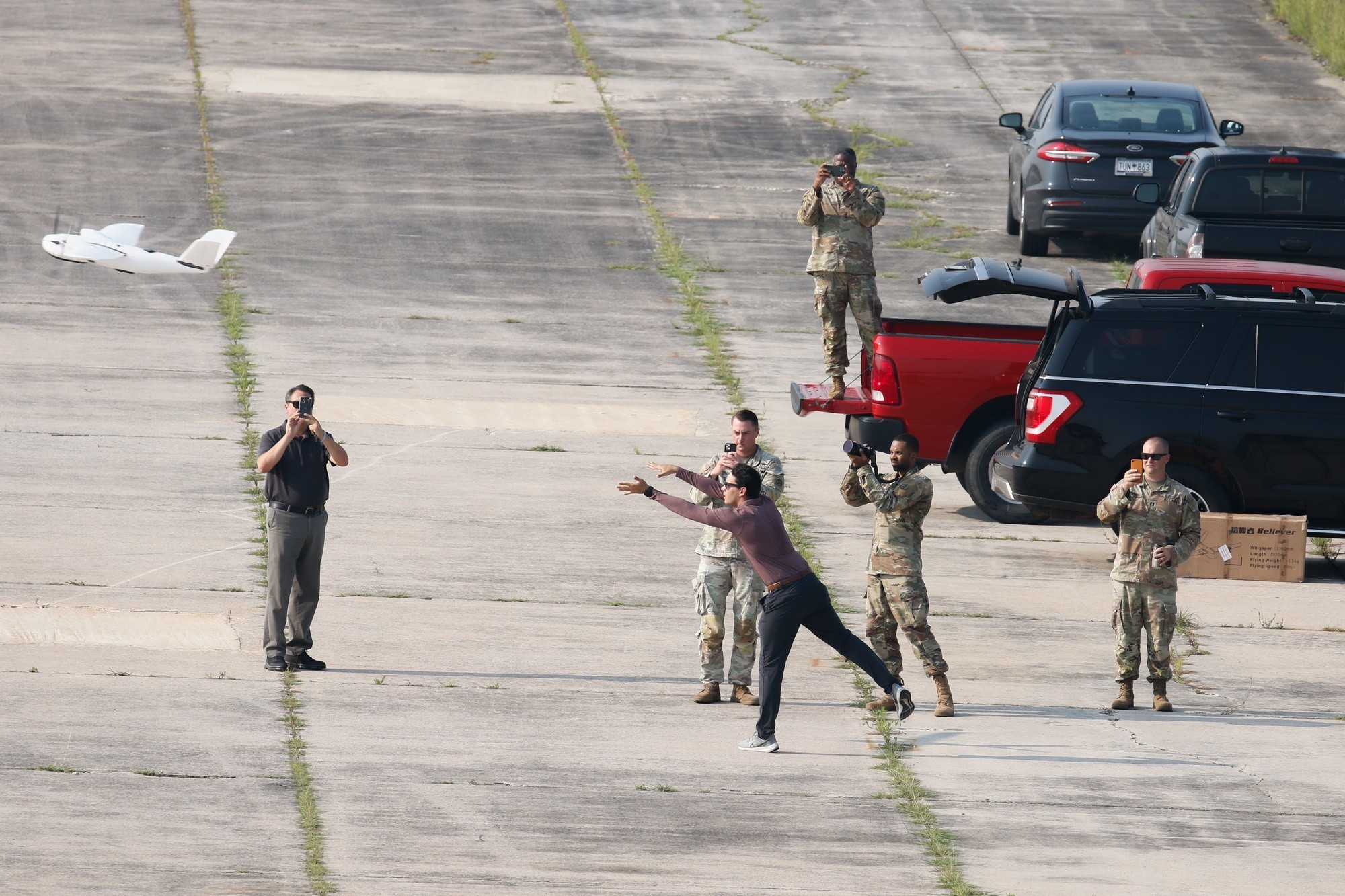 Soldiers and MITRE personnel conduct the initial testing of the CARPE Dronvm smartphone app during the launch of the testing drone. U.S. Army Central tested CARPE Dronvm at McEntire Joint National Guard Base and Poinsett Weapons Range, S.C., on July 18, 2023. (U.S. Army photo by Sgt. Amber Cobena)
