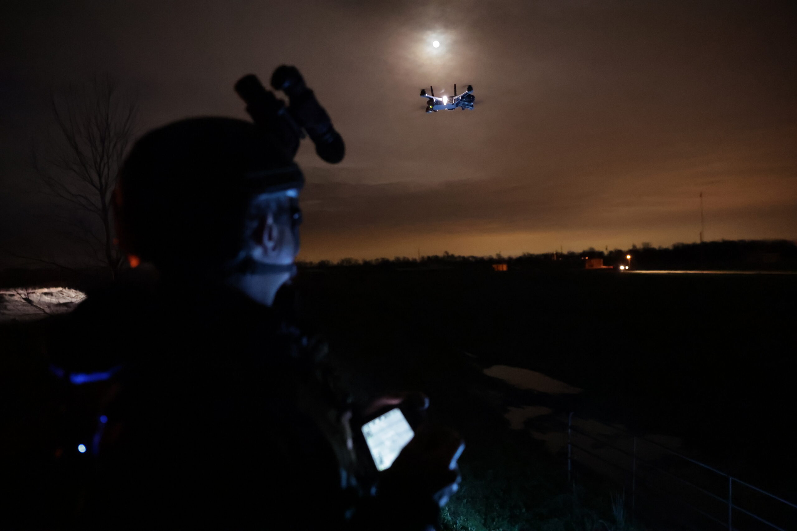 Personnel operating a Teal 2 drone at night