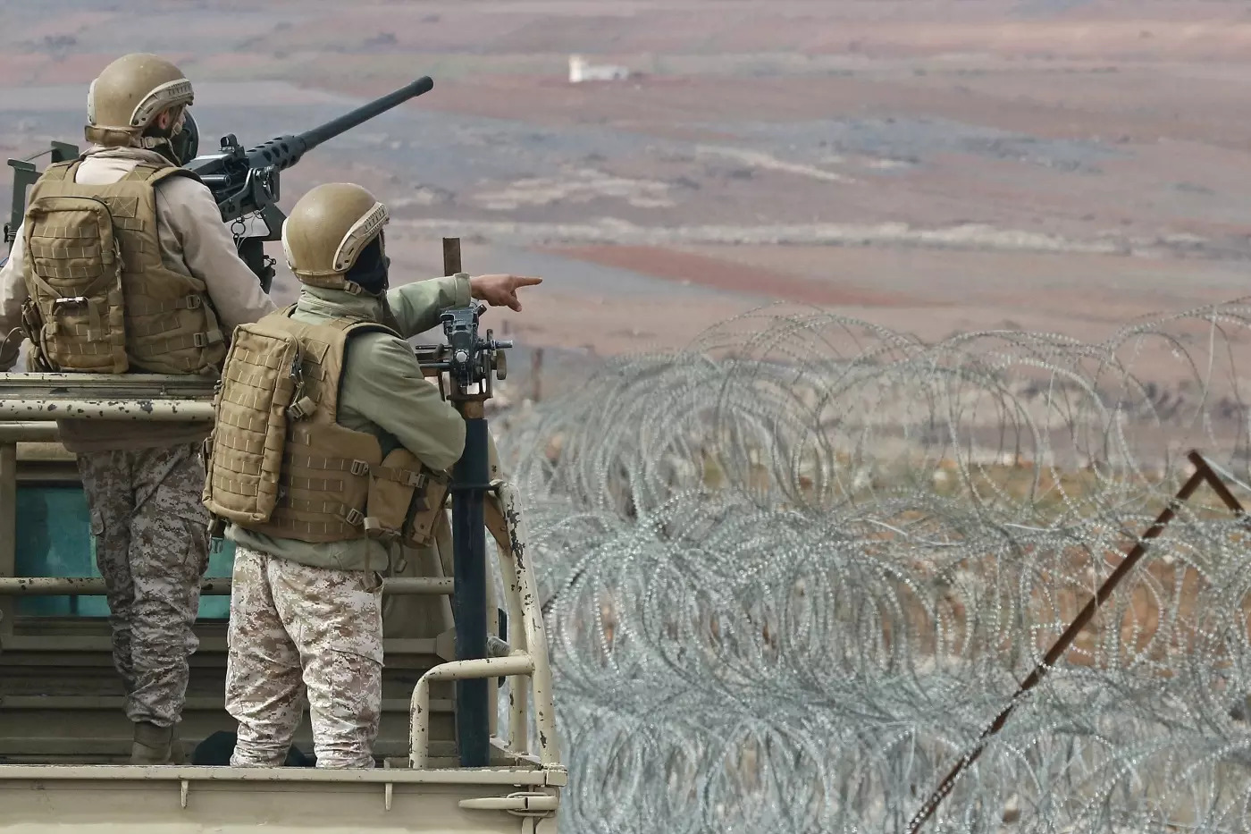 Jordanian soldiers patrol along the border with Syria