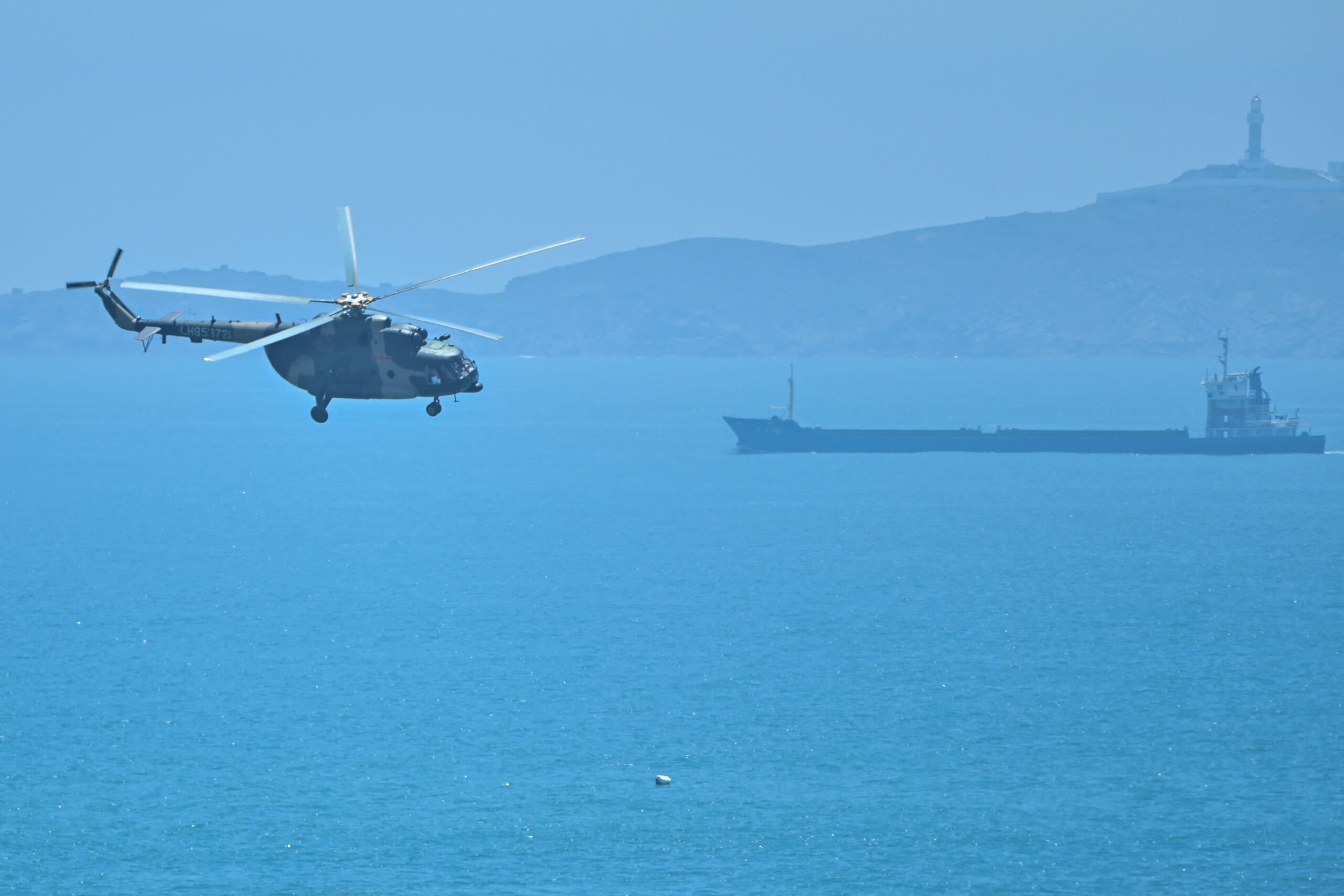 A Chinese military helicopter flies past Pingtan island, one of mainland China’s closest points to Taiwan