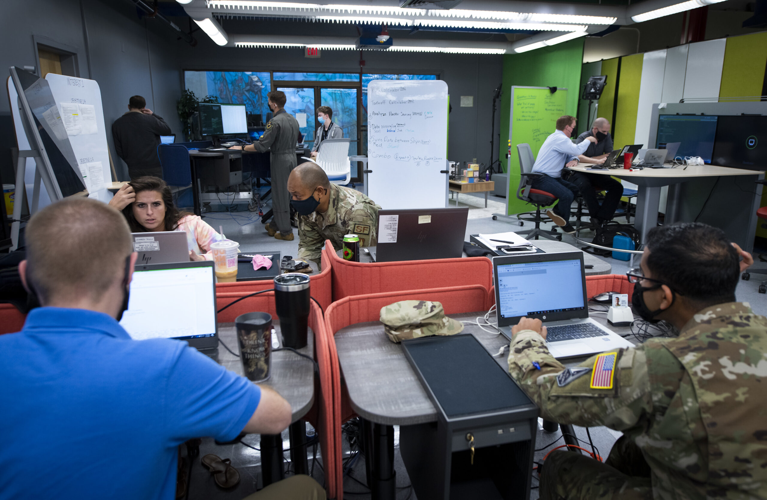 Airmen and civilians participate in the Air Force Test Center’s first-ever data hackathon Nov. 3 at Eglin Air Force Base, Fla. Teams from each AFTC base faced off to solve Air Force Test Pilot School data problems in the week-long competition. (U.S. Air Force photo/Samuel King Jr.)