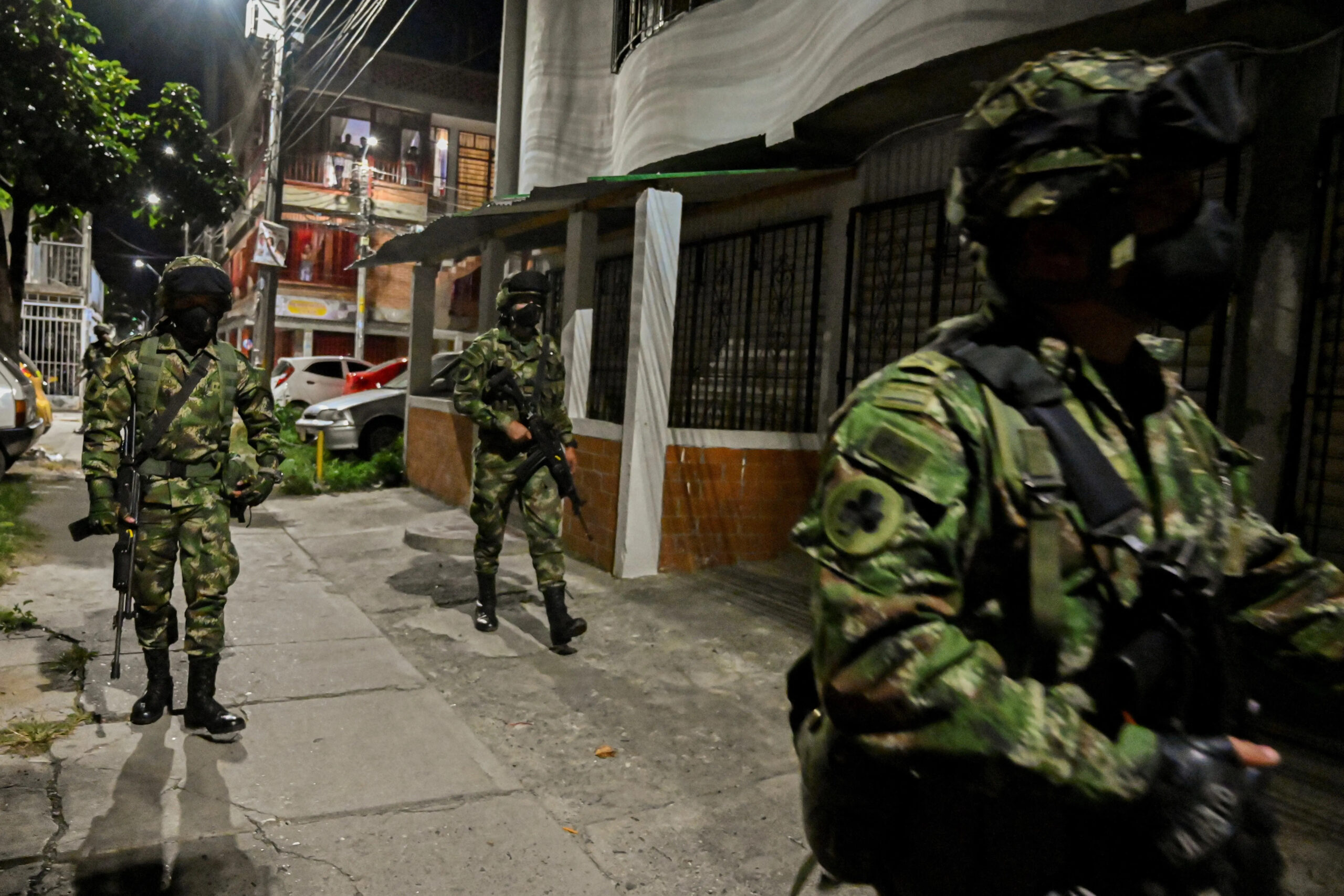 Soldiers patrol a street in Cali, Colombia