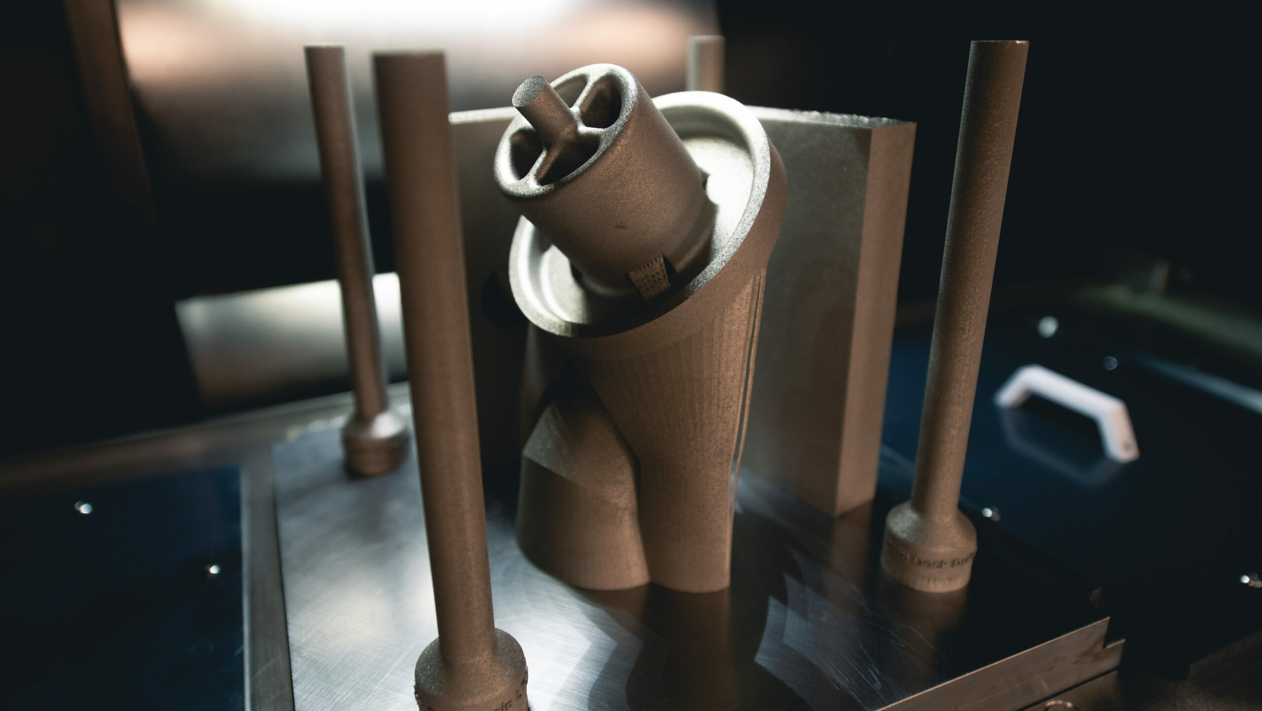 A 3D-printed copper-nickel deck drain assembly that will be installed on a Virginia-class submarine. HII’s Newport News Shipbuilding and General Dynamics Electric Boat are advancing efforts to integrate additive manufacturing technology, also known as 3D printing, into the shipbuilding process for nuclear-powered submarines. (Photo by Ashley Cowan/HII)