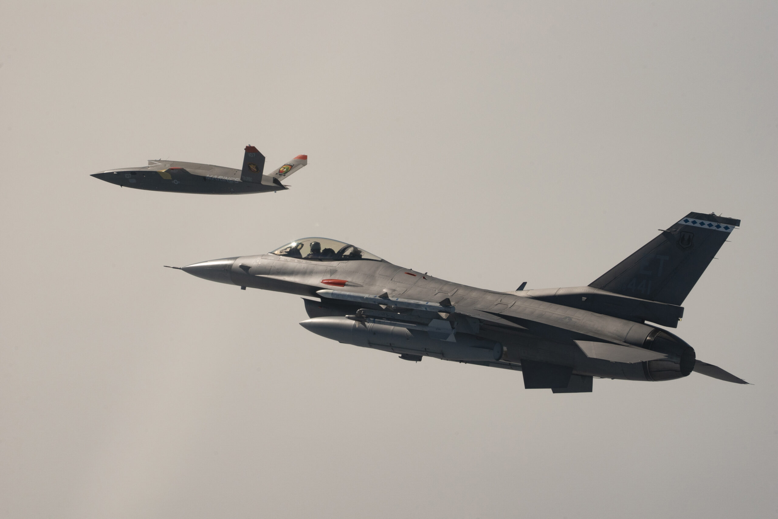 A U.S. Marine Corps XQ-58A Valkyrie, highly autonomous, low-cost tactical unmanned air vehicle, conducts its first test flight with a U.S. Air Force F-16 Fighting Falcon aircraft assigned to 96th Test Wing at Eglin Air Force Base, Fla., Oct. 3, 2023. The XQ-58A Valkyrie test flight and the data collected inform future requirements for the Marine Corps in a rapidly evolving security environment, while successfully fueling joint innovation and experimentation opportunities. (U.S. Air Force photo by Master Sgt. Tristan McIntire)