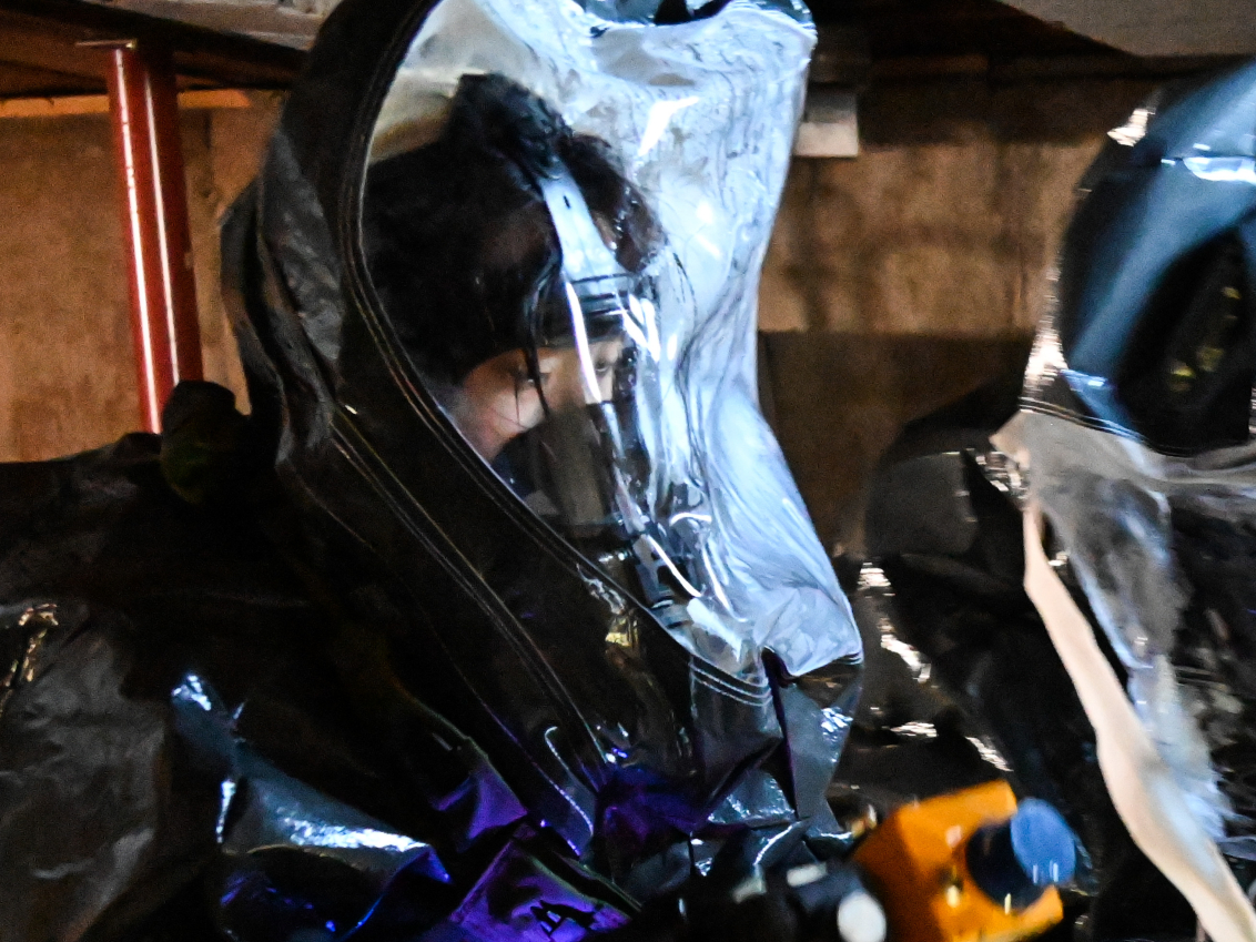 Sgt Craig Roebuck and Spc Minji Kang, survey team members from the Dismounted Chemical Reconnaissance Platoon, 10th Mountain Division participate in a training exercise at the Colonie Fire Training Center in Latham, NY, Nov 17th. During the exercise, Chemical, Nuclear, Radioactive, and Nuclear (CBRN) Specialists from Fort Drum went through training scenarios designed to familiarize them with certain equipment, expand their knowledge in responding to a CBRN situation, and to build a relationship with the New York National Guard's 2nd Civil Support Team, whose members were present to facilitate the training and offer support and mentorship. (New York National Guard photo by SSG Matthew Gunther)