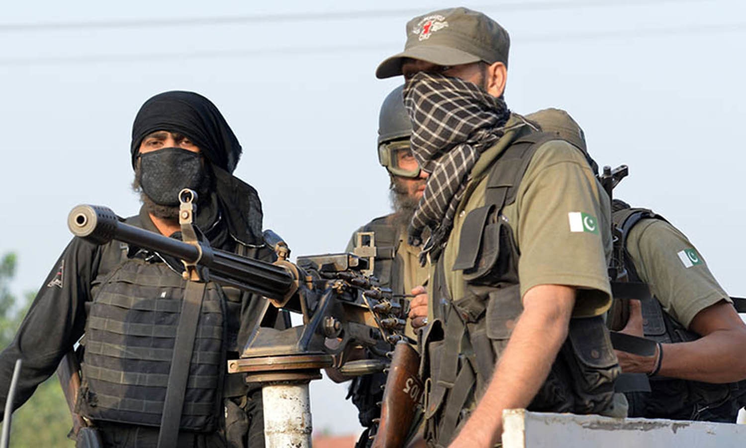 Pakistani soldiers take position outside the Pakistan Air Force base after an attack by militants in Peshawar