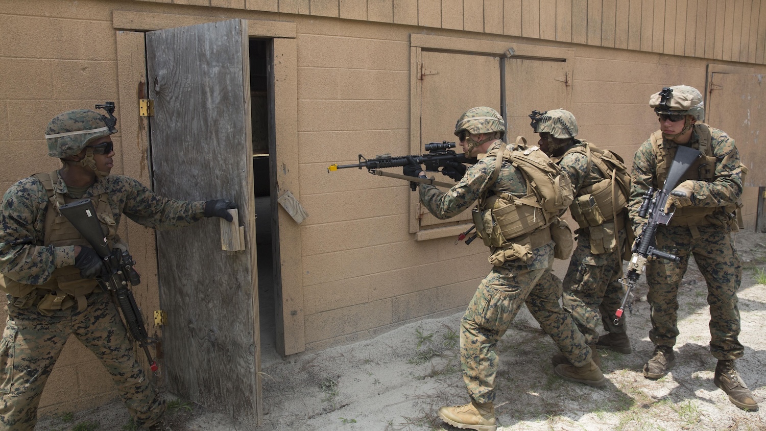 US Marines practice entering buildings during a military operations on urban terrain exercise at Marine Corps Base Camp Lejeune, 2015