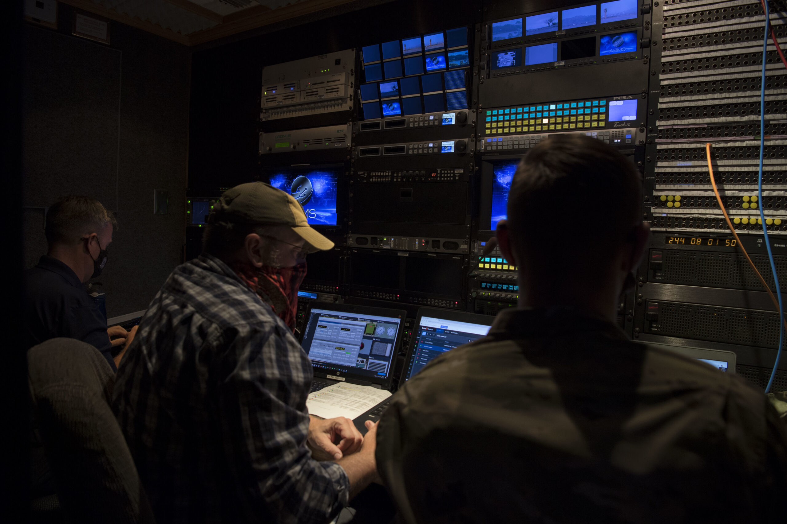 Stan Woodford, a Lead Engineer, Jason Davis, a Cyber technician and Staff Sgt. Aaron Moudry, a Client Systems technician from the 2nd Audiovisual Squadron, monitor Live feeds inside a production truck in support of the Advanced Battle Management System (ABMS) Onramp 2, Aug. 31, 2020 at Joint Base Andrews, Maryland. ABMS is an interconnected battle network - the digital architecture or foundation - which collects, processes and shares data relevant to warfighters in order to make better decisions faster in the kill chain. In order to achieve all-domain superiority, it requires that individual military activities not simply be de-conflicted, but rather integrated – activities in one domain must enhance the effectiveness of those in another domain. (U.S. Air Force photo by Senior Airman Daniel Hernandez)