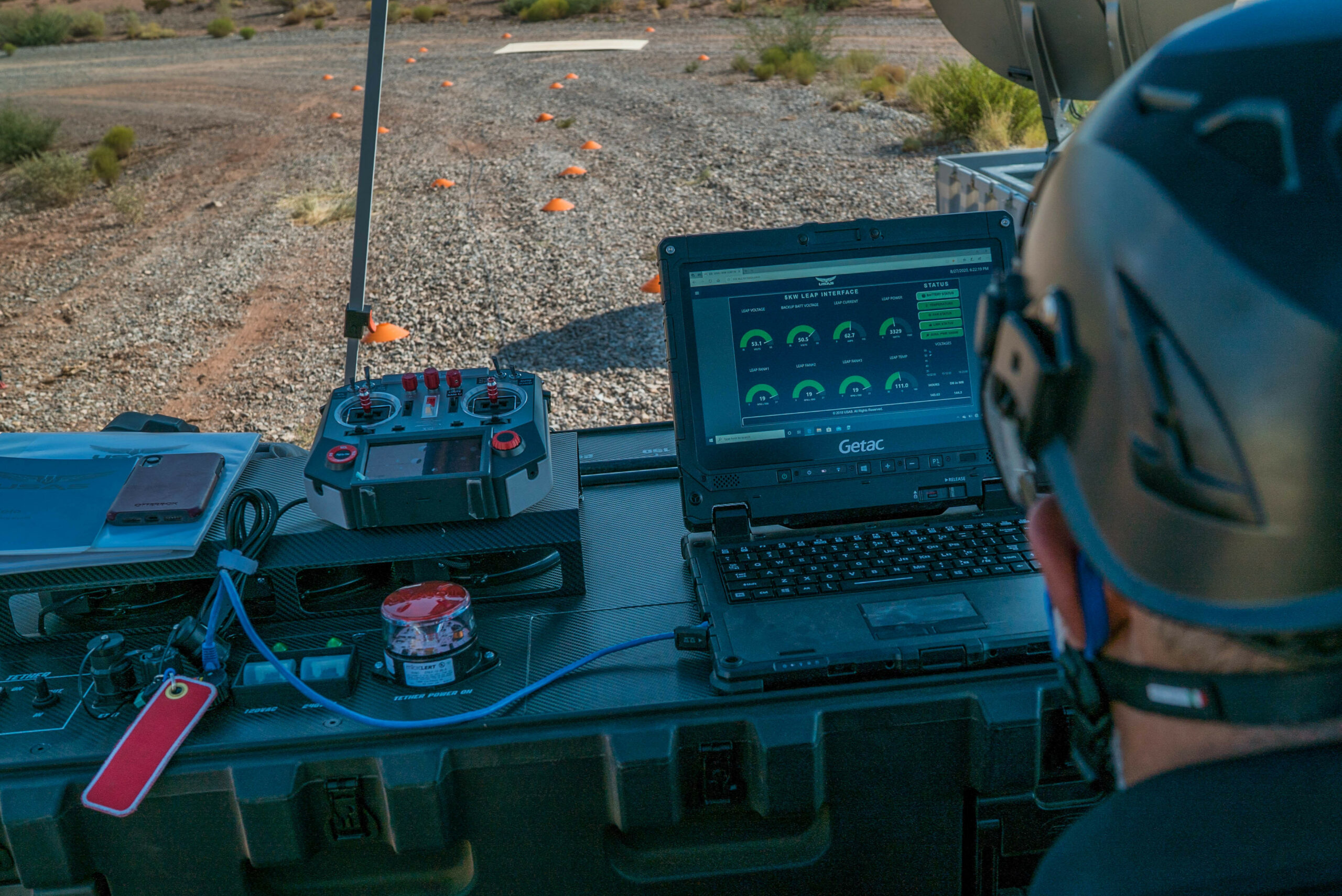 An AT&T civilian contractor monitors the status interface of a 