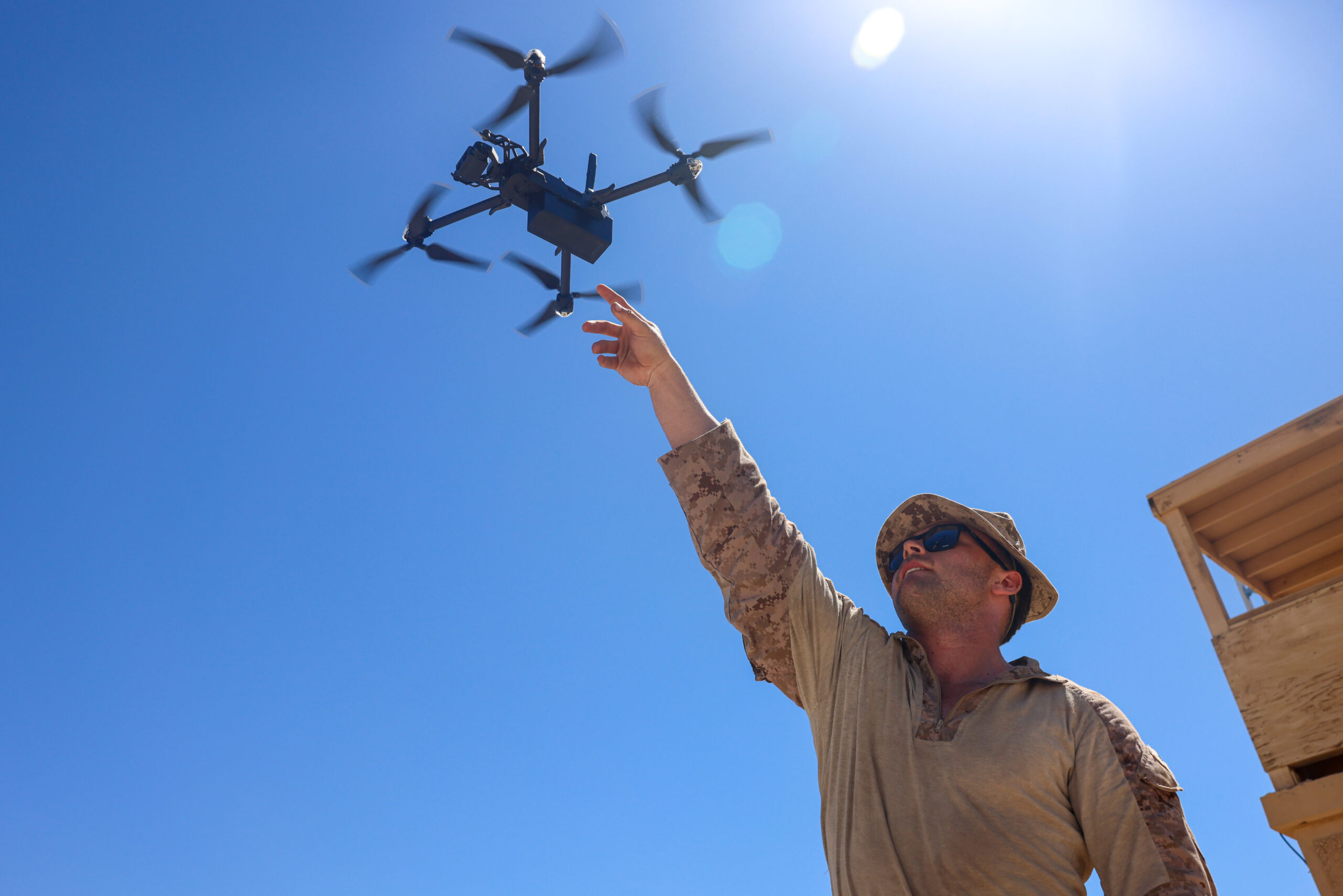 U.S. Marine Corps Cpl. Justin Wambold, a forward observer assigned to Charlie Company, Battalion Landing Team 1/5, 15th Marine Expeditionary Unit, launches a Skydio X2D, a small unmanned aerial system, to capture overhead imagery during squad attacks as part of Realistic Urban Training exercise at Yuma Proving Grounds, Arizona, Aug. 15, 2023. RUT is a land-based predeployment exercise which enhances the integration and collective capability of the Marine Air-Ground Task Force while providing the 15th MEU an opportunity to train and execute operations in an urban environment. (U.S. Marine Corps photo by Cpl. Aidan Hekker)