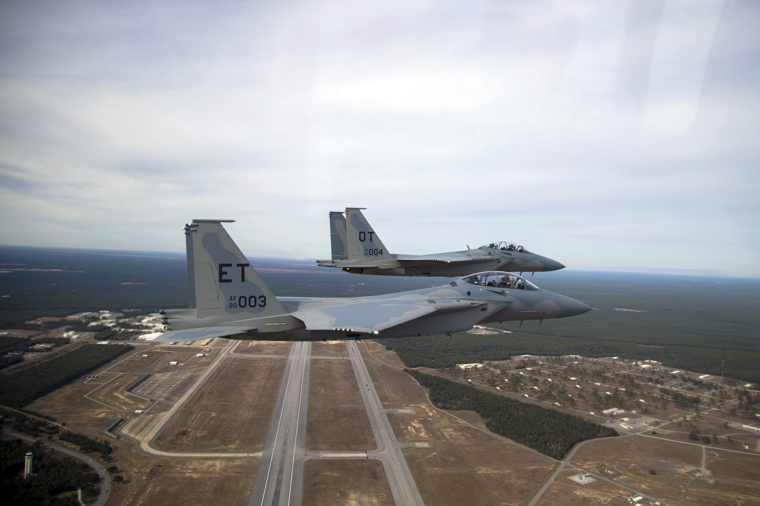 Two new F-15EX fighter jets, EX3 and EX4, arrive at Eglin Air Force Base, Florida, on Dec. 20, 2023. EX3 and EX4 are the Air Force’s newest fighter jets and have updated features such as the cockpit pressure monitor and warning system and an ultra-high frequency antenna for satellite communications. The 40th Flight Test Squadron and 85th Test and Evaluation Squadron will conduct developmental and operational tests on the aircraft. (U.S. Air Force photo by Staff Sgt. Blake Wiles)