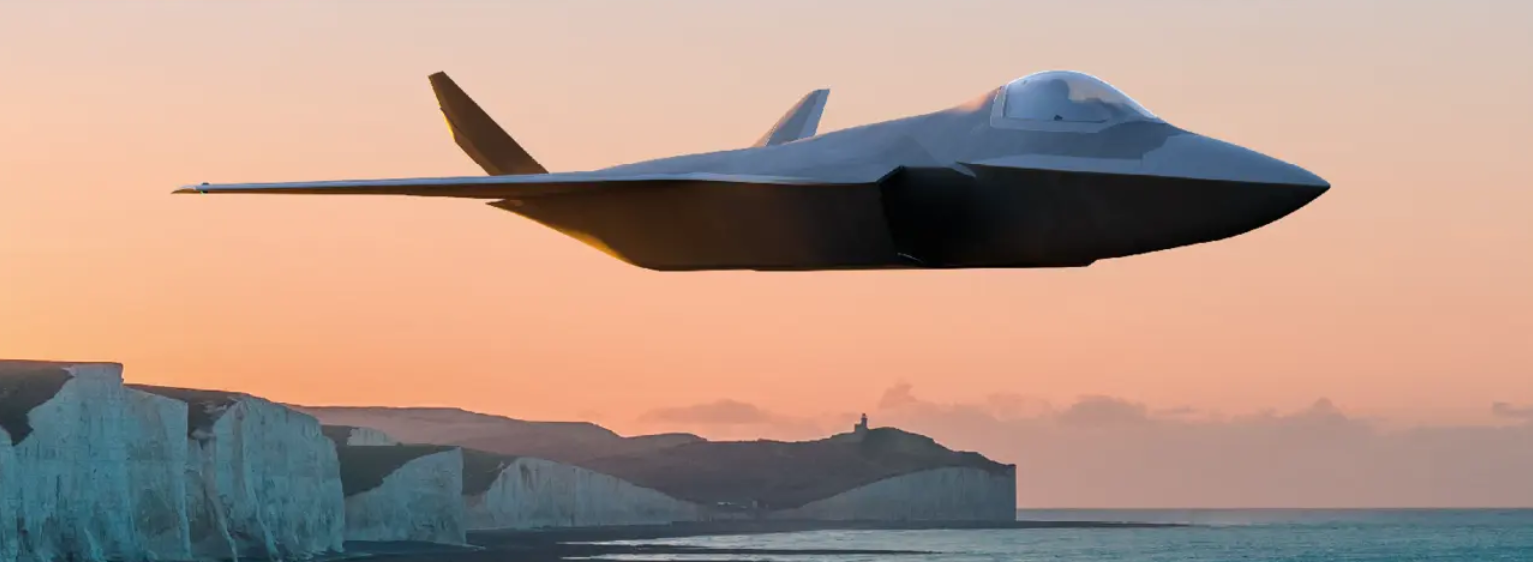 A grey stealth fighter jet is seen flying in front of a shoreline during sunset. A lighthouse close to the white cliff face is seen over the horizon. The sky is a warm orange color.