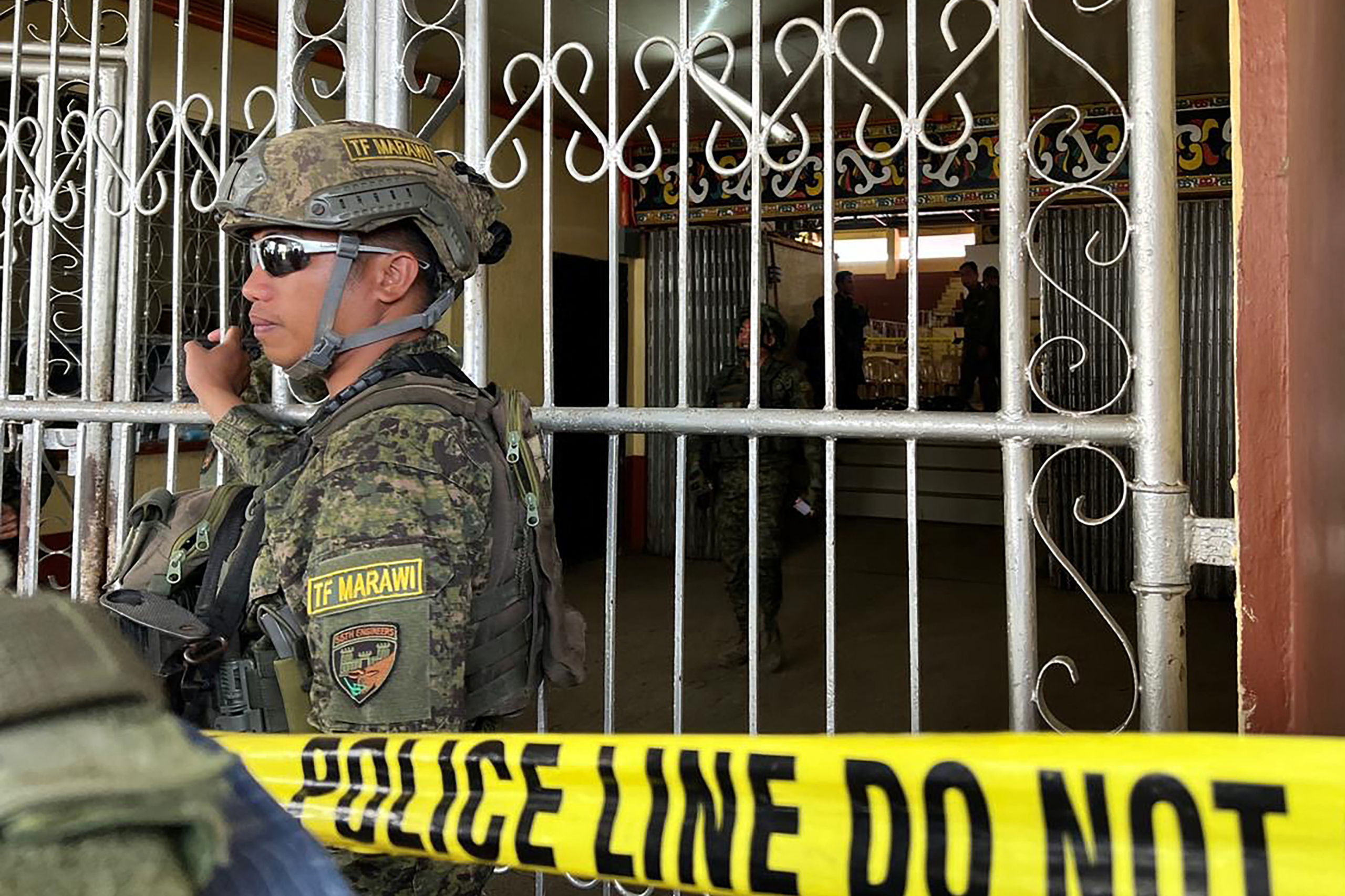 Philippine armed personnel after a bomb attack