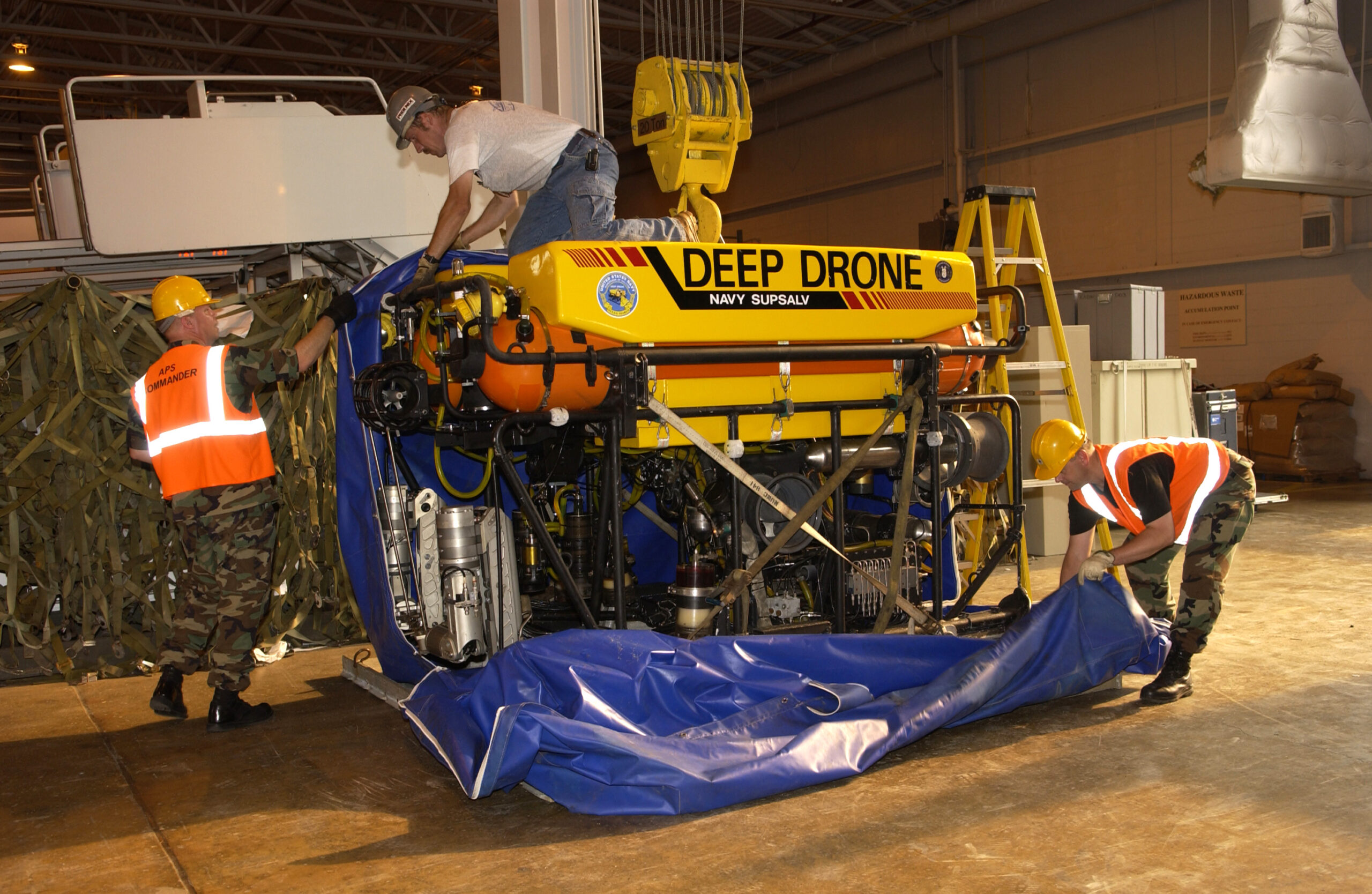 050805-F-M8968-002 Andrews, Air Force Base (AFB), Md. (August 5, 2005) - Members of the 89th Aerial Port Squadron (APS), Andrews AFB, and 32nd APS Air Reserve Squadron, Pittsburgh, Pa., prepare to load Deep Drone 8000 onto a C-17 Globemaster III from Charleston, South Carolina. The U.S. Navy Supervisor of Salvage and Diving (SUPSALV) is deploying a Deep Drone 8000 Remotely Operated Vehicle (ROV), capable of operating at a depth up to 8000 feet. The Deep Drone 8000 has a target locating sonar and two tool manipulators capable of working with tools and attaching rigging. The Navy and Air Force are transporting Deep Drone in an effort to assist the rescue of seven Russian Sailors trapped on the ocean floor in a mini-submarine off the Kamchatka Peninsula. U.S. Air Force photo by SSgt Christopher J. Matthews (RELEASED)