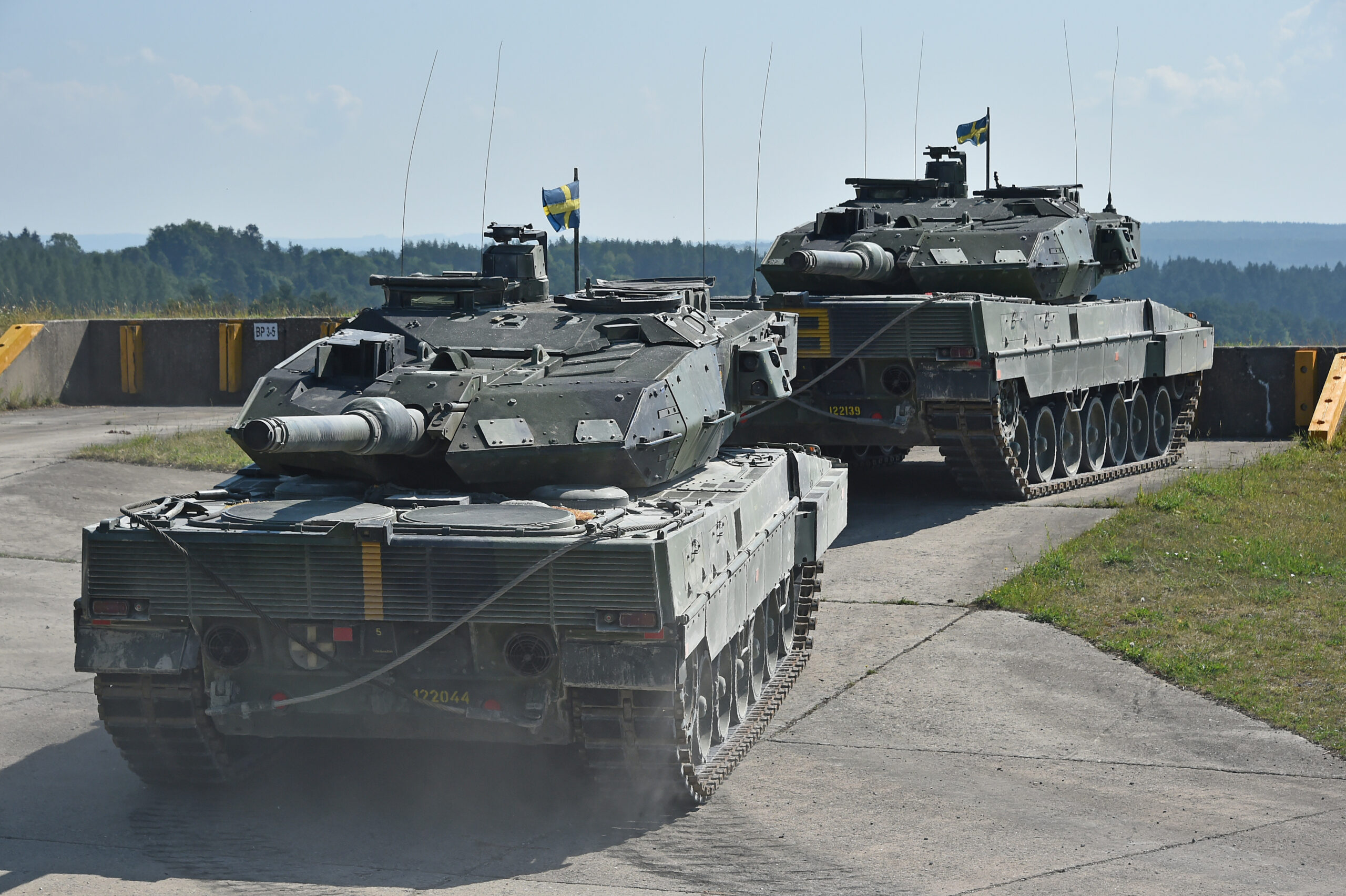 Swedish soldiers with the Wartofta Tank Company, Skaraborg Regiment in their Stridsvagn 122 main battle tank tow away another tank as part of the Chemical, Biological, Radiological, Nuclear, and Explosive Agents lane during the Strong Europe Tank Challenge at the 7th Army Training Command’s Grafenwoehr Training Area, June 4, 2018. The U.S. Army Europe and the German Army co-host the third Strong Europe Tank Challenge, which is an annual training event designed to give participating nations a dynamic, productive and fun environment in which to foster military partnerships, form Soldier-level relationships, and share tactics, techniques and procedures. (U.S. Army photo by Gertrud Zach)
