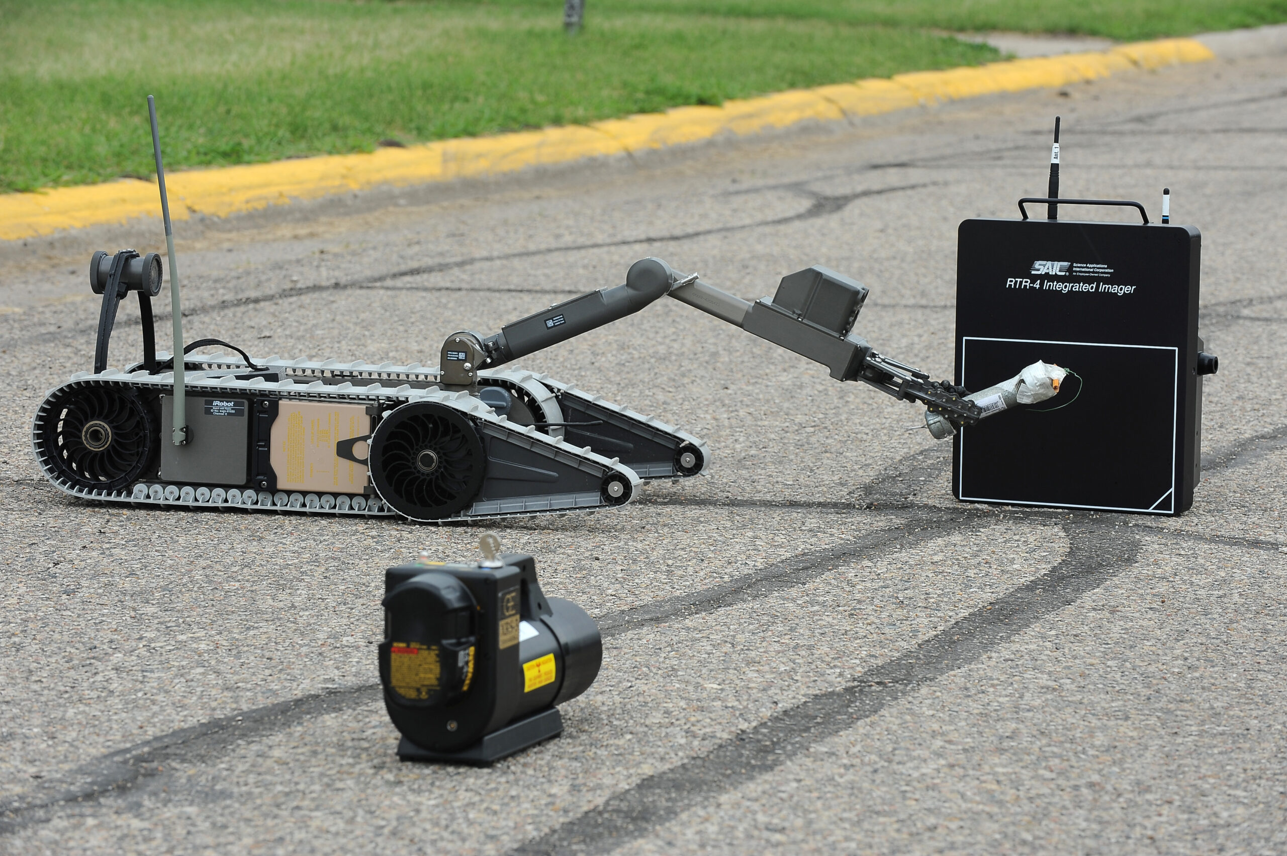 An EOD robot remotely operated by members of the 5th Civil Engineer Squadron explosive ordnance disposal, performs diagnostics on a simulated pipe bomb during an exercise here June 6. The robot is used by 5th CES EOD personnel to recon areas not cleared for human entry and disarming potential explosive devices. Exercises like these are vital training tools used throughout the year to ensure wing personnel are trained to provide safe, secure, effective conventional and nuclear operations as mandated by Air Force Global Strike Command.