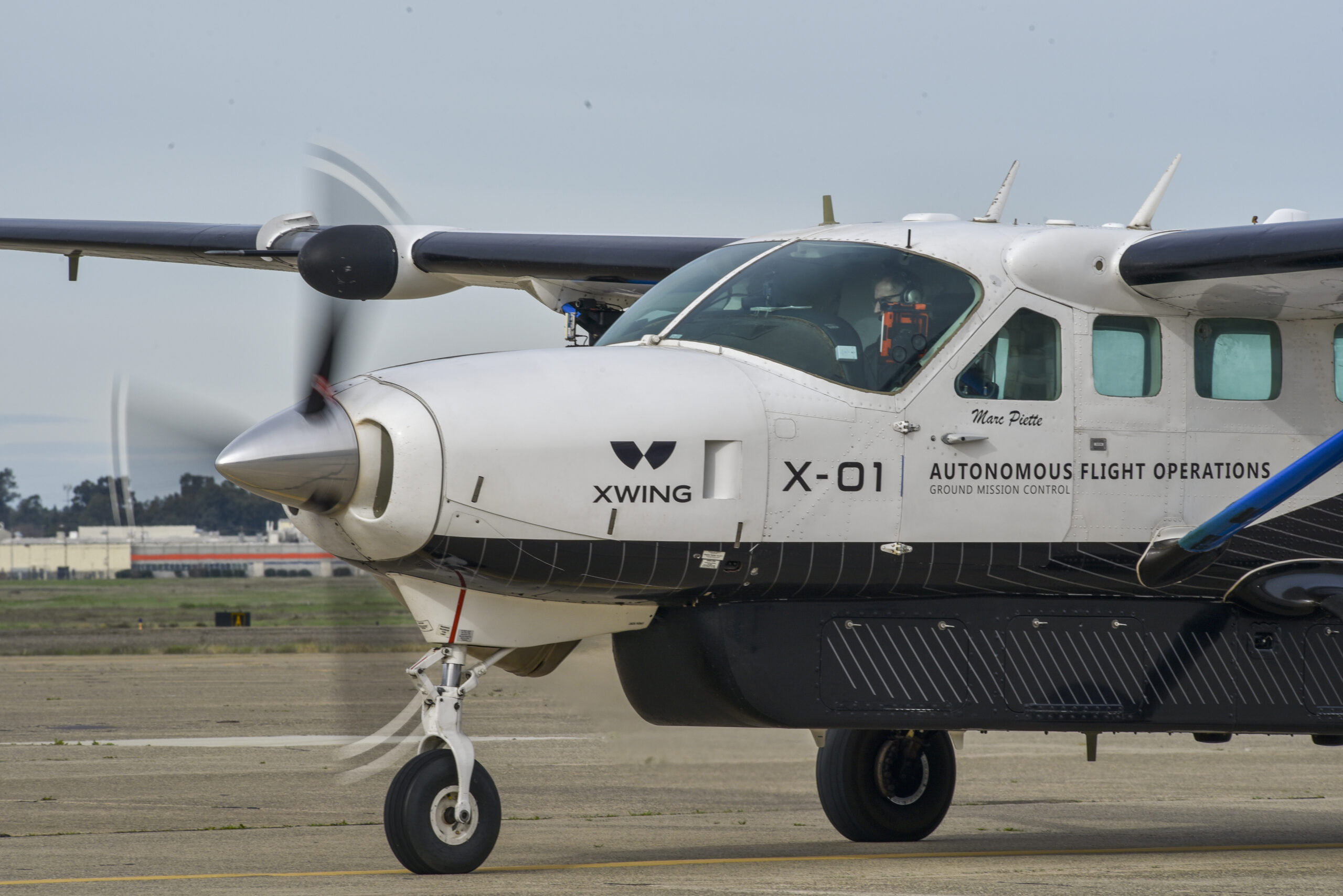 Gabriele Di Francesco, Xwing safety pilot, prepares for takeoff in N101XW, a Cessna 208B Grand Caravan that flies autonomously, at McClellan Airfield in Sacramento, California, Jan. 27, 2024. AFWERX, the innovation arm of the Department of the Air Force, has awarded Xwing two Small Business Innovation Research contracts, a Phase Two in March 2023 to conduct autonomous flight trials and optimize the technology for future missions and a Phase Three in December 2023 to demonstrate the capability in an operationally relevant environment. Xwing's autonomous flight technology allows its aircraft to taxi, takeoff, fly to a destination, avoid airborne and ground threats, and land, without any human input. (U.S. Air Force photo by Matthew Clouse)