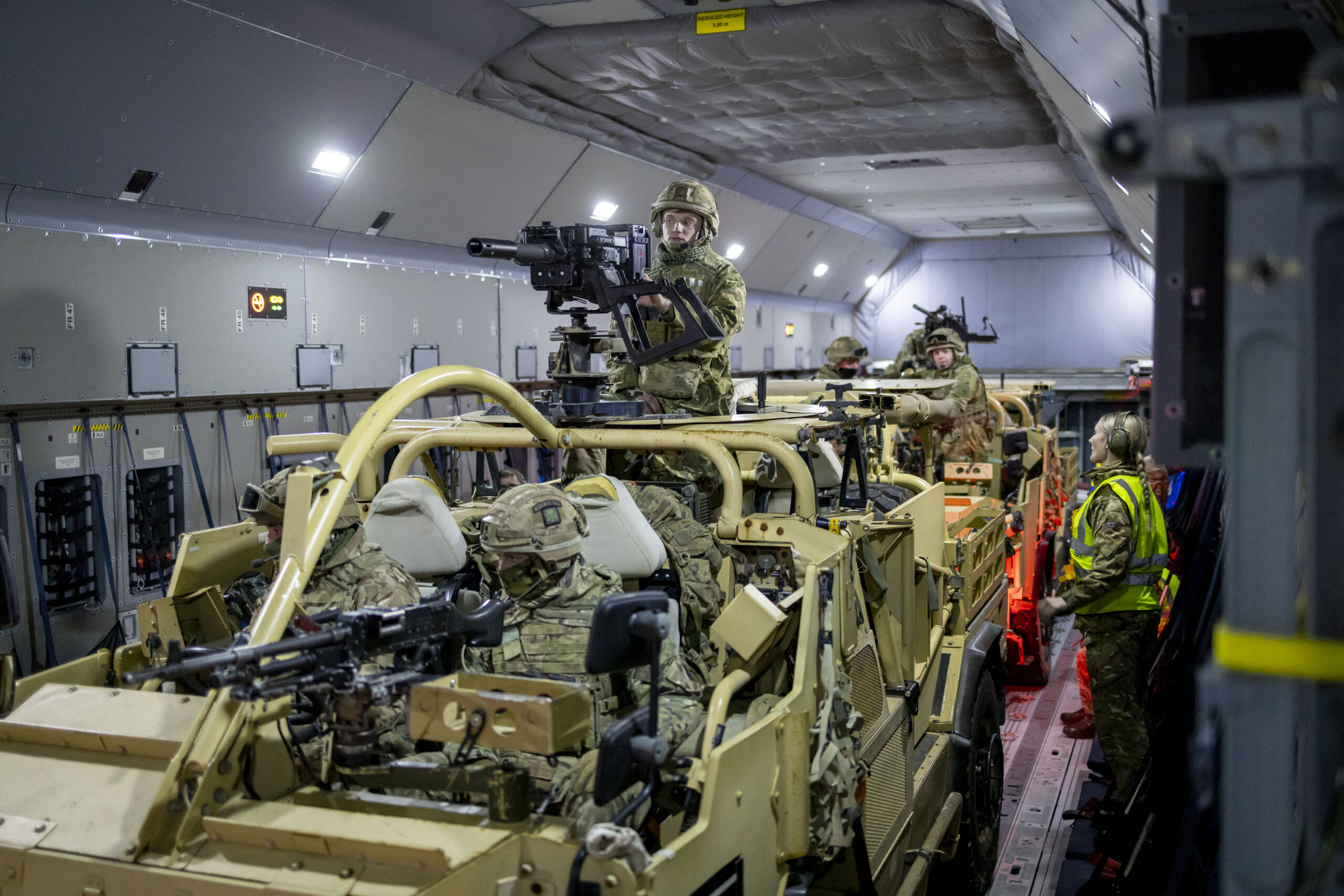 Jackal 2 Reconnaissance vehicles and their crew from the 1st Battalion, The Royal Irish Regiment, ready to drive off the Royal Air Force (RAF) ATLAS C.1 (A400M) aircraft after a Rapid Air Landing (RAL) at RAF Shawbury on Exercise Pegasus Clover on the 12th of December 2023.1st Battalion The Royal Irish Regiment (1 R IRISH) worked with an RAF ATLAS C.1 aircraft at RAF Shawbury to develop their airlanding skills. Troops loaded and secured Land rovers on the aircraft, and then took flight to practise getting off the aircraft and into the fight as fast as possible. The skills learnt on Exercise Pegasus Clover are vital for the unit in its role in 16 Air Assault Brigade, the British Armys global response force. The brigade is trained and equipped to be ready to deploy by air at short notice to respond to international crises, from evacuations to warfighting. 1 R IRISH, based at Clive Barracks in Tern Hill, serves in 16 Air Asslt Bde as light recce strike infantry, a new concept that the unit is currently developing. The intent is to provide a highly mobile force that can seek out battle winning information, while having the firepower to hit the enemy hard. It has the flexibility to deploy onto operations by airlanding or driving, as well as conducting helicopter operations.