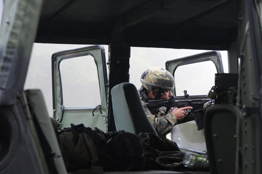 A Czech soldier from 1st Czech Military Advisory Team (MAT) aims his Bren 805 rifle during a MAT and police advisory team (PAT) training exercise at the Joint Multinational Readiness Center in Hohenfels, Germany, Sept. 18, 2012. This exercise is designed to replicate the Afghanistan operational environment in order to prepare MATs and PATs for counterinsurgency operations with the ability to train, advise and enable the Afghanistan National Army and the Afghanistan National Police.