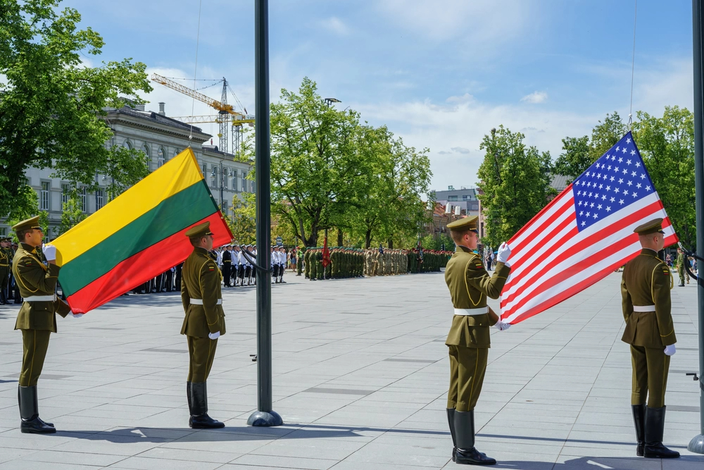 Service members from the United States, Lithuania and several other nations participate in a ceremony to celebrate the 25th Anniversary of the Lithuanian and Pennsylvania Army National Guard’s participation in the State Partnership Program (SPP) in downtown Vilnius, Lithuania, June 10, 2018. The SPP, allows the National Guard to strengthen international relationships while conducting military-to-military engagements in support of defense security goals across the world. (U.S. Army photo by Sgt. Gregory T. Summers / 22nd Mobile Public Affairs Detachment)