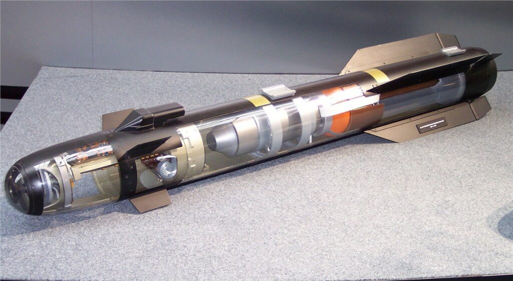 A model of a Hellfire AGM-114R2 missile is seen on display. Parts of its body is transparent, showcasing its inner parts and mechanisms.