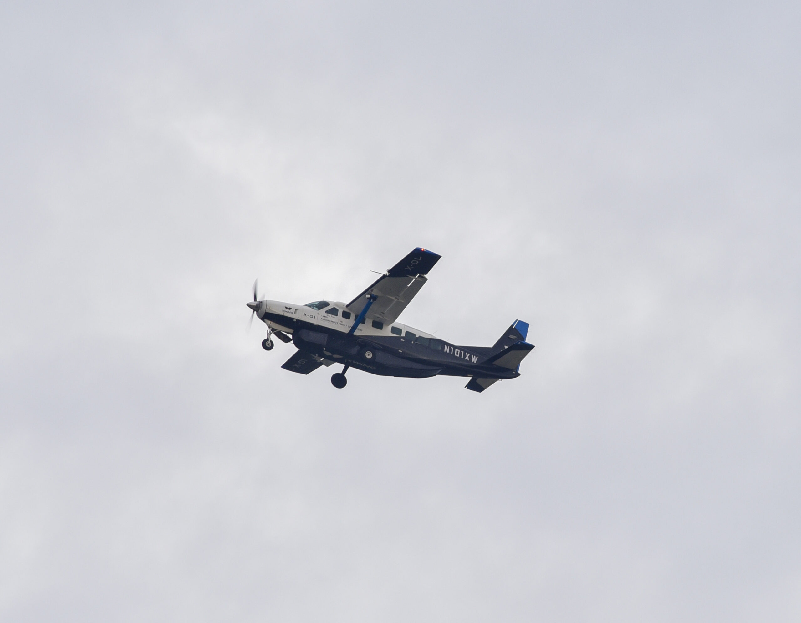 Xwing's autonomous aircraft, N101XW, a Cessna 208B Grand Caravan, takes off duing AGILE FLAG 24.1 at McClellan Airfield in Sacramento, California, Jan. 31, 2024. AFWERX, the innovation arm of the Department of the Air Force, has awarded Xwing two Small Business Innovation Research contracts, a Phase Two in March 2023 to conduct autonomous flight trials and optimize the technology for future missions and a Phase Three in December 2023 to demonstrate the capability in an operationally relevant environment. Xwing's autonomous flight technology allows its aircraft to taxi, takeoff, fly to a destination, avoid airborne and ground threats, and land, without any human input. (U.S. Air Force photo by Matthew Clouse)