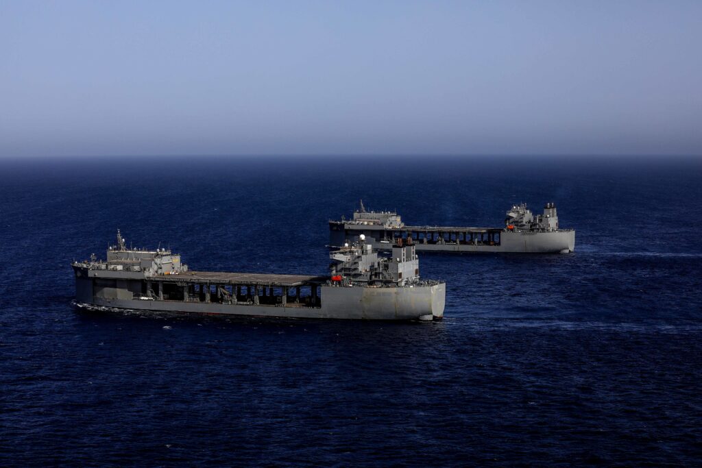 220726-A-EQ028-1350 GULF OF ADEN (July 26, 2022) Expeditionary sea bases USS Hershel “Woody” Williams (ESB 4) and USS Lewis B. Puller (ESB 3) sail together in the Gulf of Aden, July 26. Lewis B. Puller is deployed to the U.S. 5th Fleet area of operations to help ensure maritime security and stability in the Middle East region. (U.S. Army Photo by Spc. Frederick Poirier)