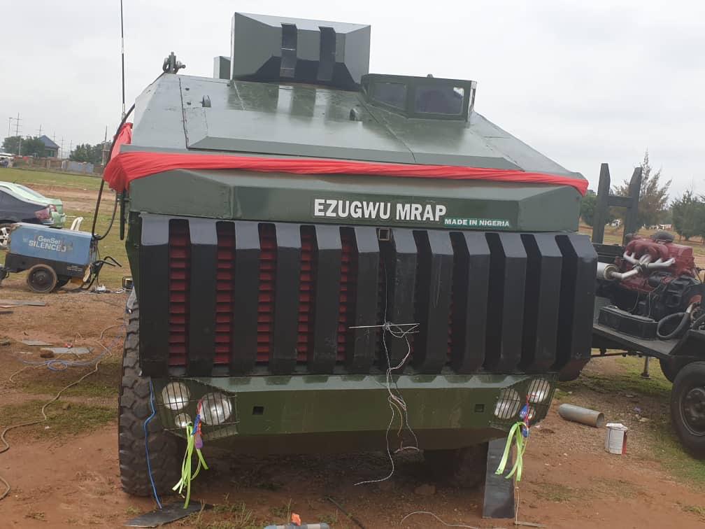 An Ezugwu Mine-Resistant Ambush Protected vehicle is seen parked. The armored vehicle is painted green, with the words 