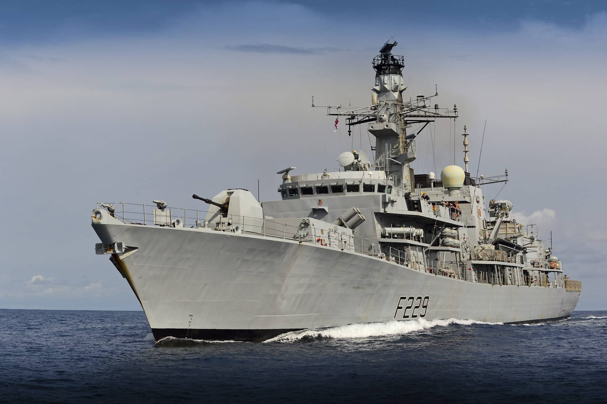 UK's HMS Lancaster warship is seen sailing deep blue waters. The gray ship has 
