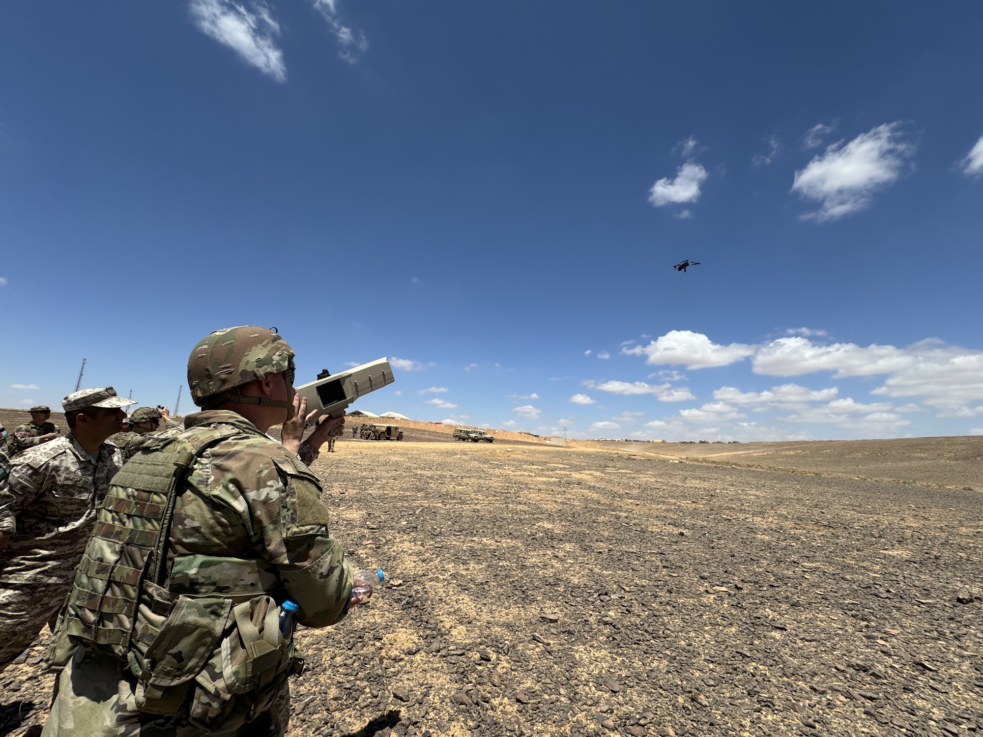 Jordanian Armed Forces service members and U.S. Army service members select a target while aiming their Dronebuster during Eager Lion 2024 in Jordan, May 13, 2024. Dronebusters are designed to neutralize drones by overwhelming their control frequency Eager Lion 2024 is a multilateral exercise, with 33 participating nations, hosted by the Hashemite Kingdom of Jordan, designed to exchange military expertise, and improve interoperability among partner nations, and considered the capstone of a broader U.S. military relationship with the Jordanian Armed Forces. Jordan is one of U.S. Central Command’s strongest and most reliable partners in the Levant sub-region.