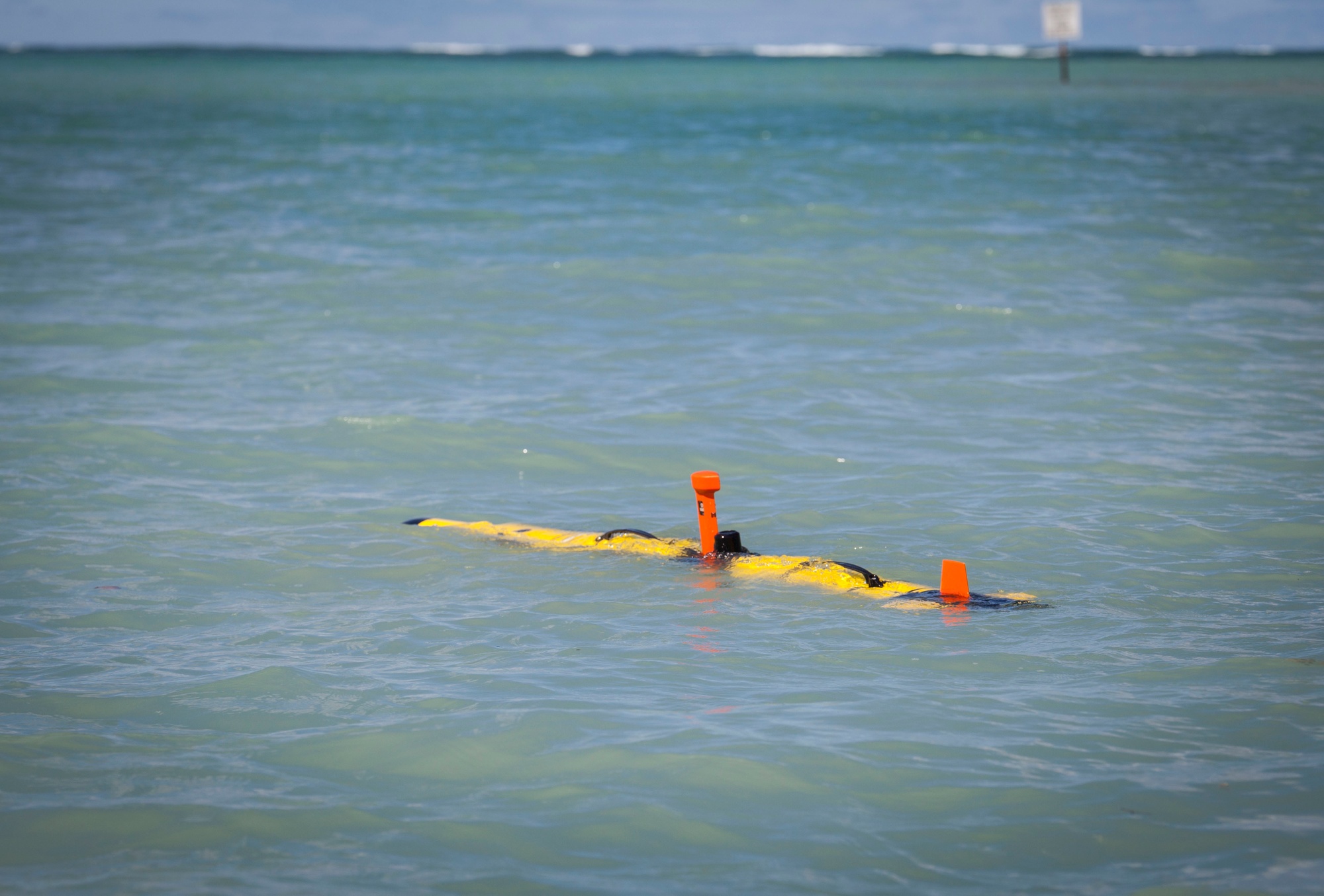 An Iver3-580 Autonomous Underwater Vehicle surfaces in Kaneohe Bay during an informational brief aboard Marine Corps Base Hawaii, Sept. 6, 2017. The AUV was demonstrated by the Naval Research Laboratory and 3rd Reconnaissance Battalion for senior leaders with Marine Corps Forces, Pacific. The system is a state of the art autonomous device that could help provide amphibious units with quick and accurate underwater survey data. (U.S. Marine Corps photo by Cpl. Jesus Sepulveda Torres)