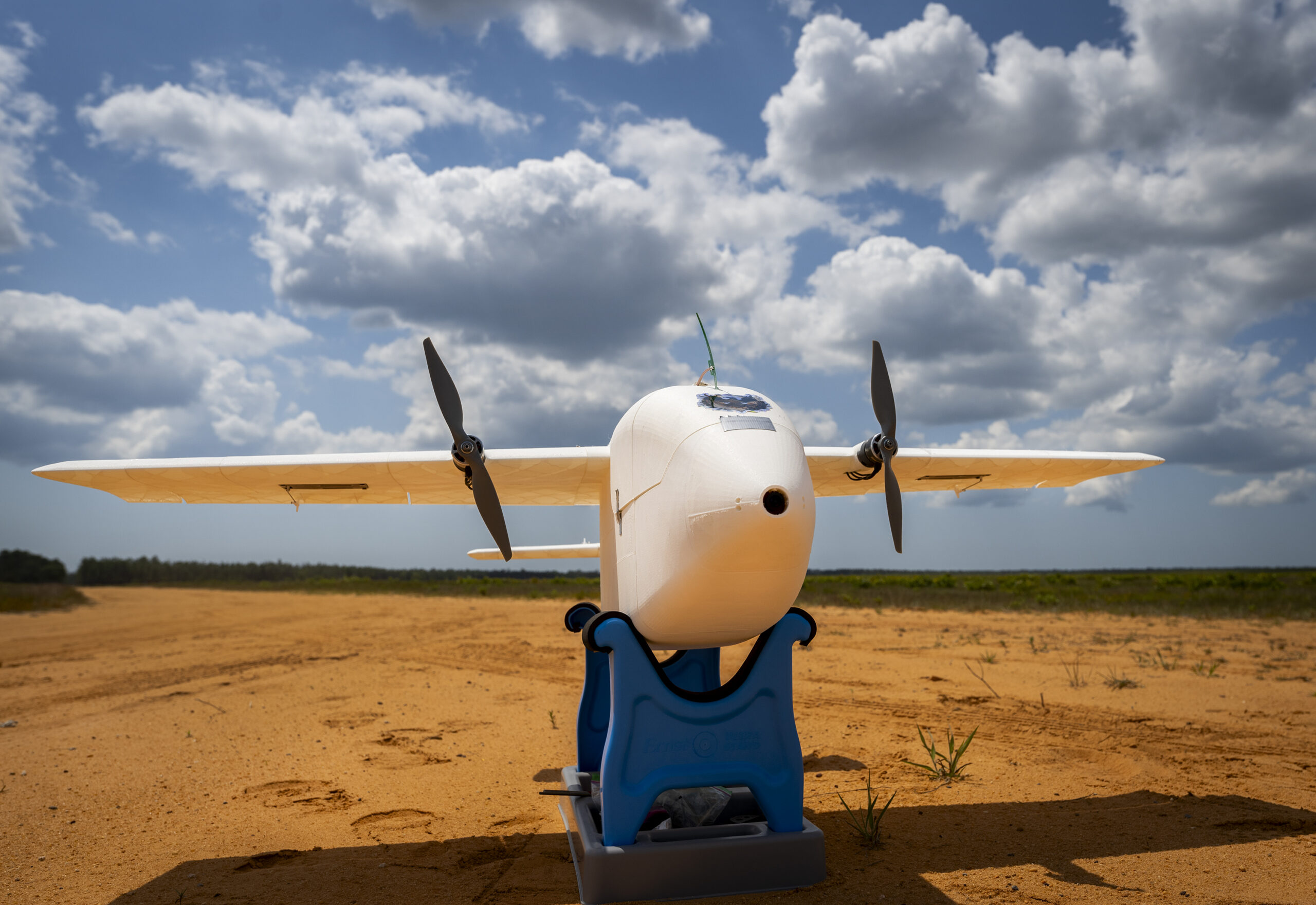 A 3D-printed unmanned aerial system sits ready for its first flight during a Blue Horizons demonstration April 25, 2024 at Eglin Air Force Base, Florida. The goal of the demonstration was to create, build and fly a UAS within 24 hours. The team spent the week at Eglin creating UASs for various designs and mission specialties. (U.S. Air Force photo by Samuel King Jr.)