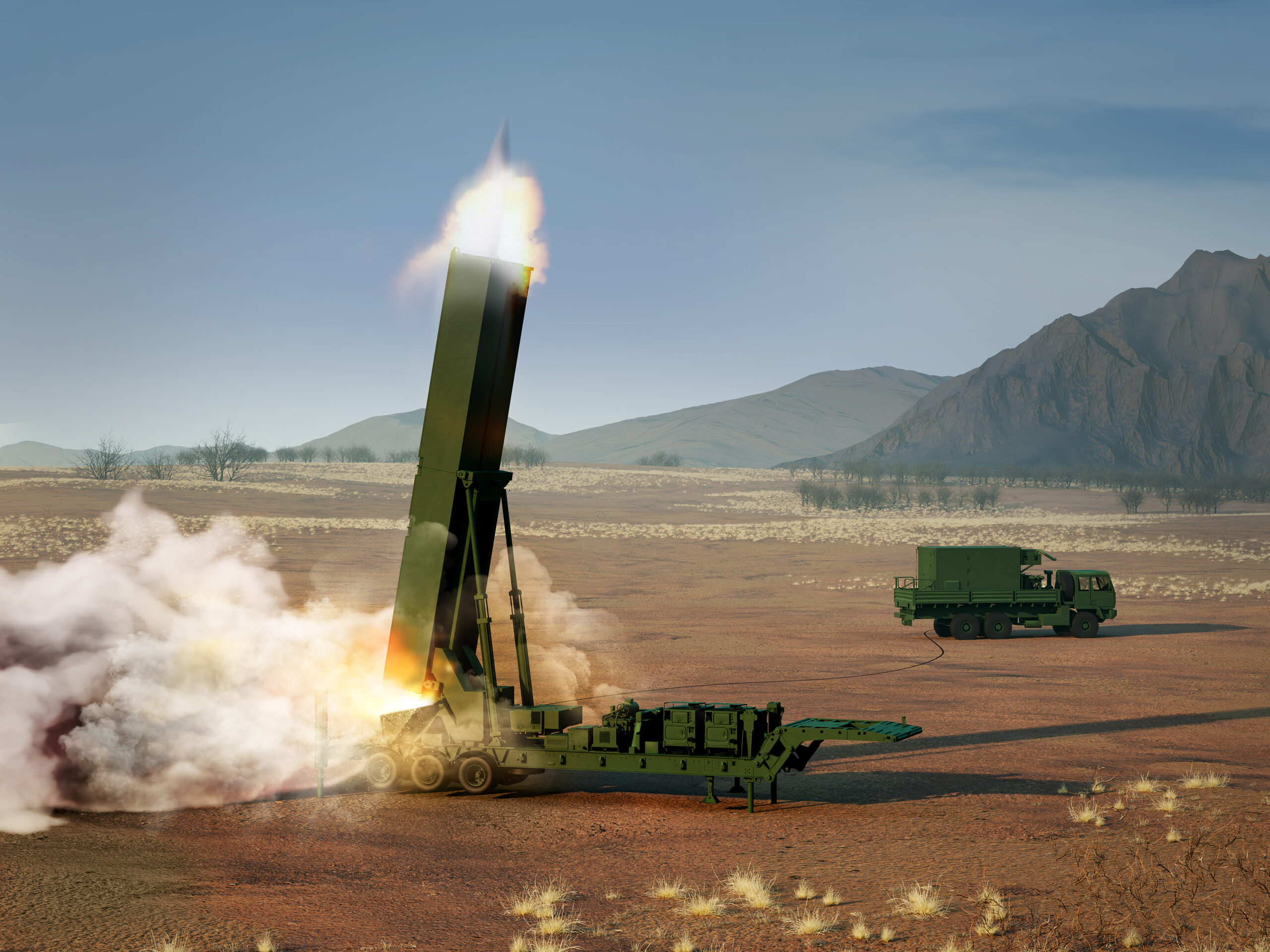 A Long Range Hypersonic Weapon (LRHW) system is seen firing off a missile upwards in the middle of a brown plains area. The system is attached to a six-wheel hydraulic launching system that attaches to a six-wheel truck. The truck is seen a little farther back, on the right side of the image. Both the vehicle and the weapon system is painted green. The background is a scenic view of a mountain range, with a grayish-blue sky occupying the rest of the space.