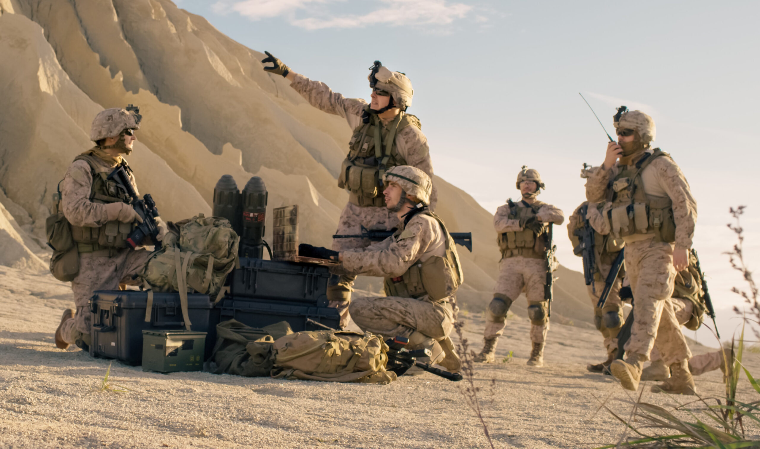 Soldiers are Using Laptop Computer afor Surveillance During Military Operation in the Desert.