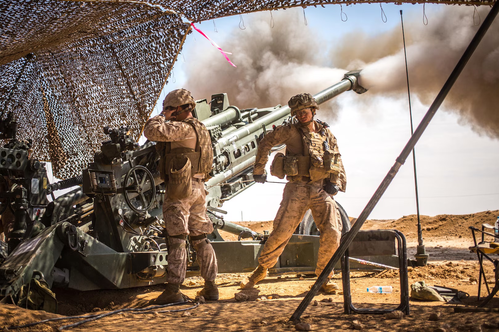 Marines with the 11th Marine Expeditionary Unit fire an M777 Howitzer during a fire mission in northern Syria as part of Operation Inherent Resolve