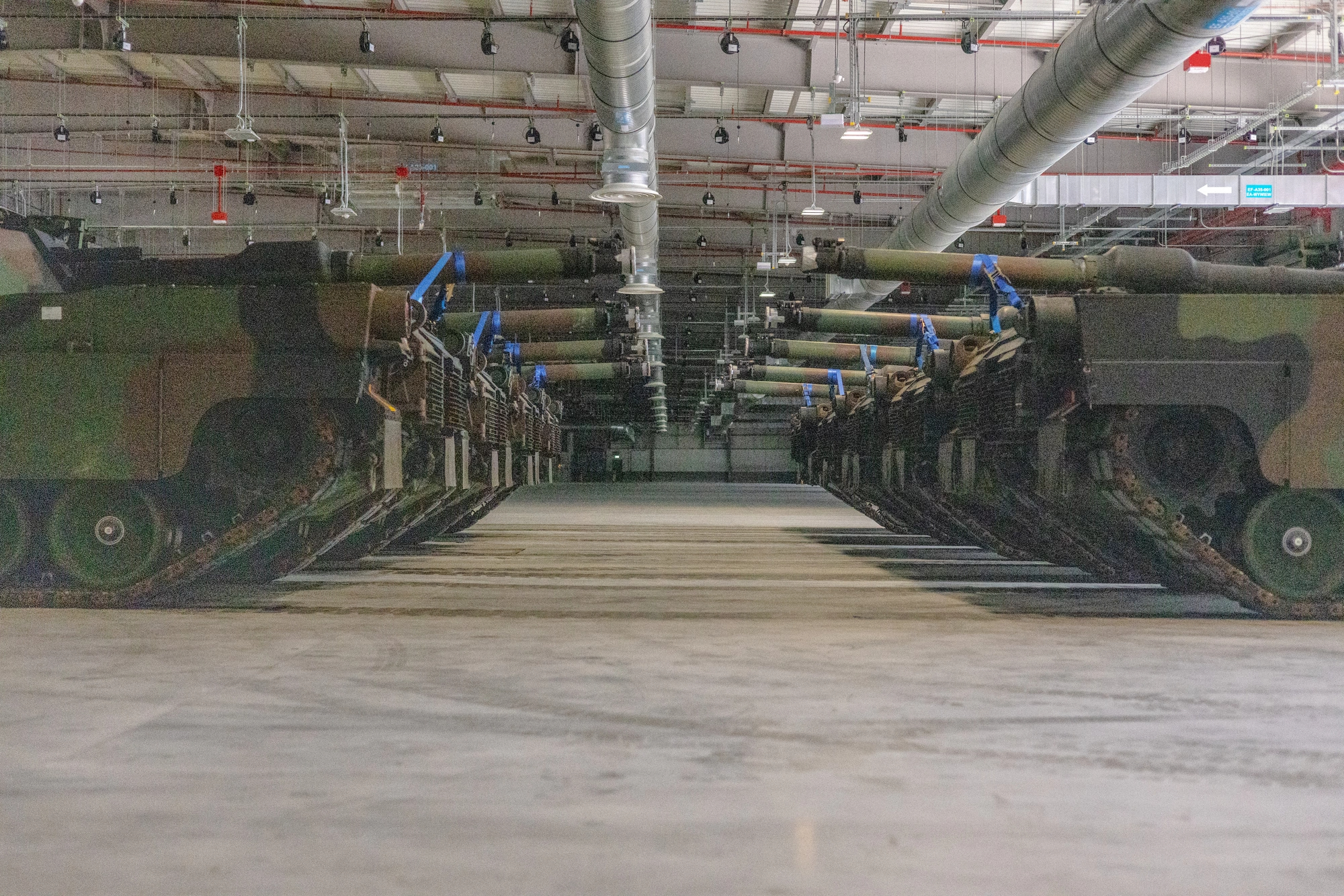 M1 Abrams tanks are positioned in the storage facility to maximize space at the Powidz APS-2 Worksite, Powidz, Poland, on June 28, 2024. The Powidz APS-2 Worksite enhances the Army’s ability to rapidly and dynamically employ forces within theater, improving deterrence capabilities and readiness. (U.S. Army photo by Capt. Michael Mastrangelo)