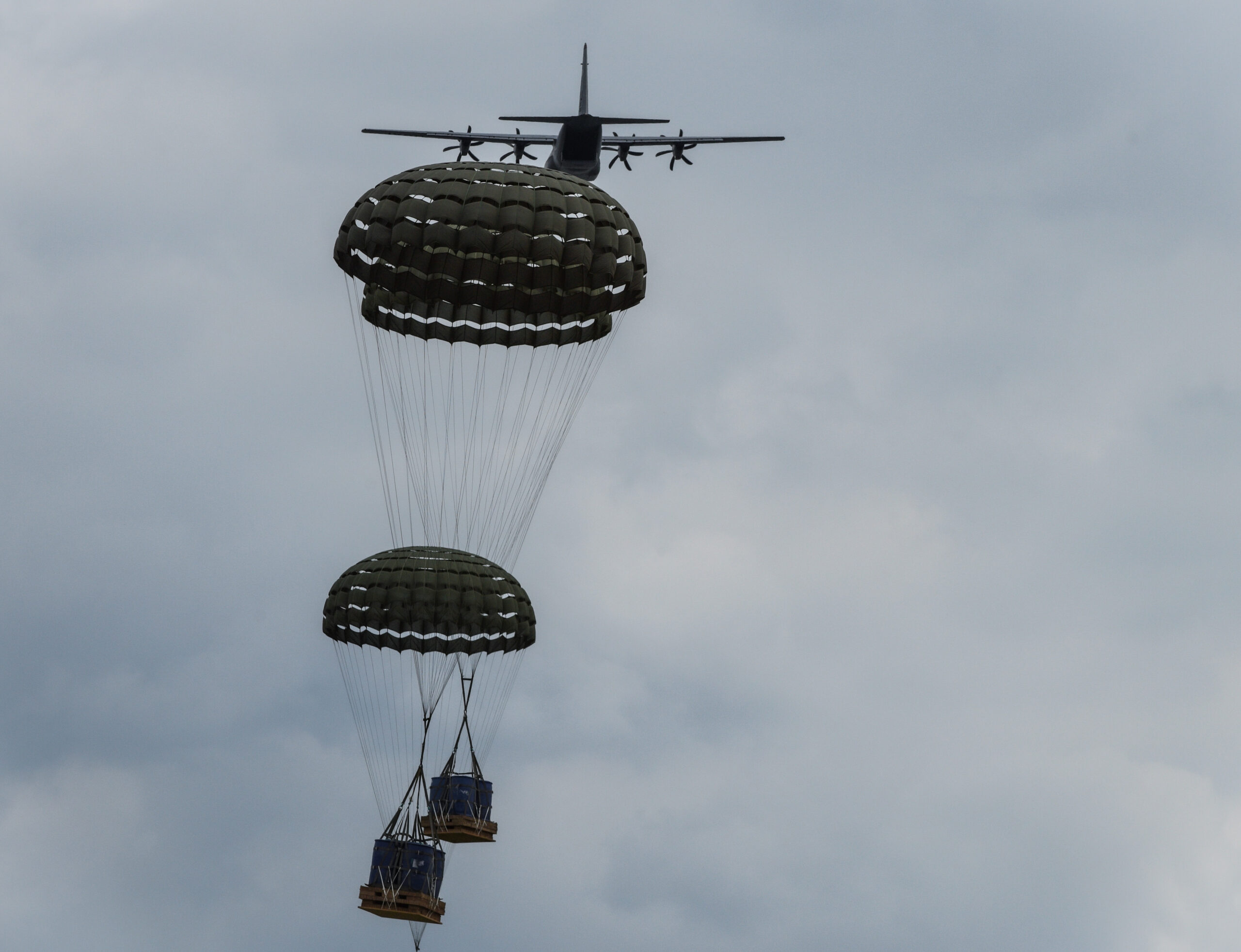 A U.S. Air Force C-130J Super Hercules assigned to the 374th Airlift Wing, Yokota Air Base, Japan, delivers pallet drops over a designated landing zone near Yeoju, Republic of Korea, June 25, 2024. The Republic of Korea is a critical ally to the United States in the Indo-Pacific region and is key to peace and security. (U.S. Air Force photo by Tech. Sgt. Ericka McCammon)