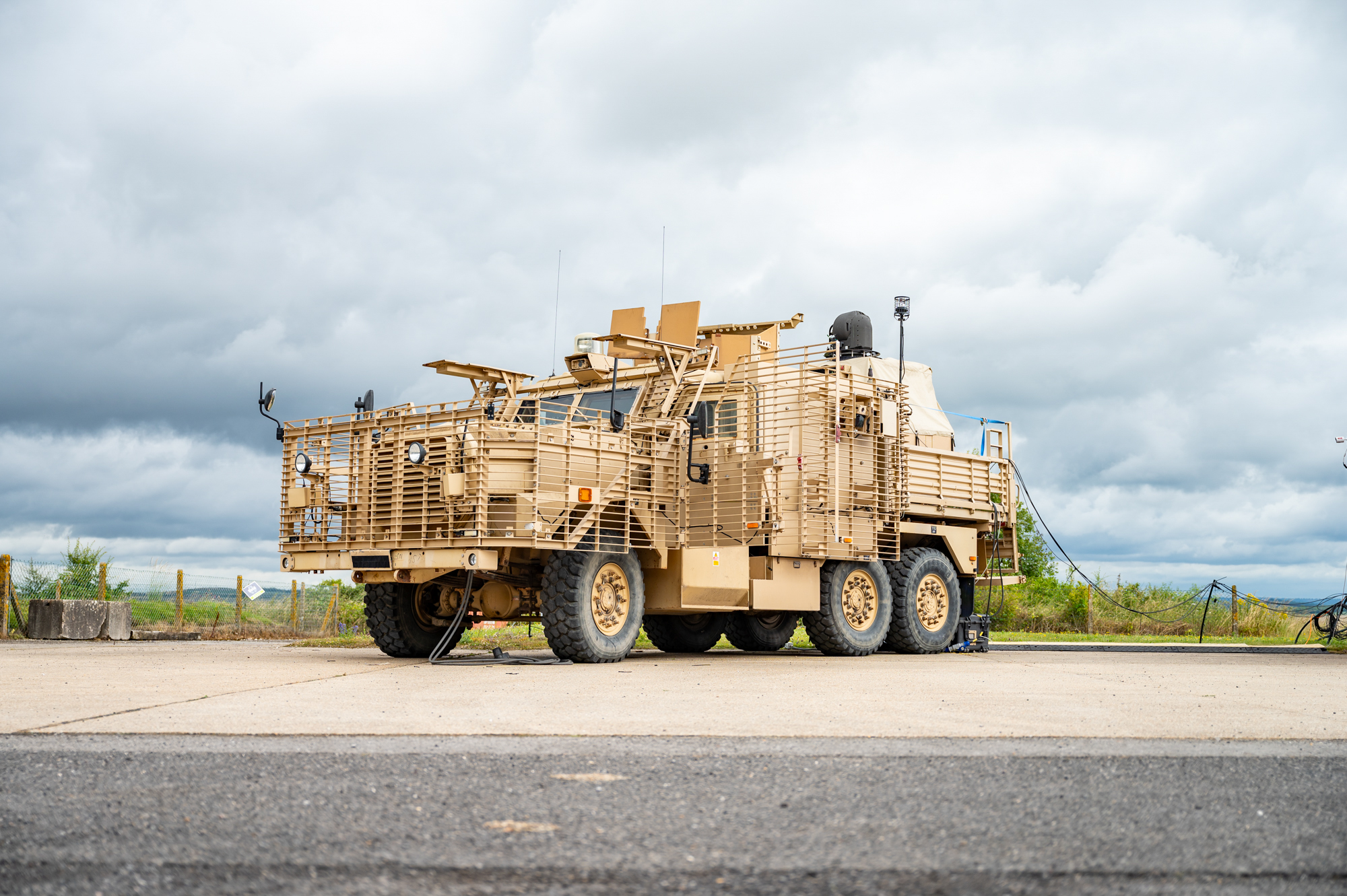 Image a British Army Wolfhound armoured vehicle, seen here with a mounted portable Laser Directed Energy Weapon (LDEW). For the first time scientists and engineers have successfully fired a high powered laser energy weapon from a British Army combat vehicle. This ground-breaking test, conducted at Dstls range in Porton Down, saw the laser weapon neutralise targets at distances in excess of 1km. The high-energy laser weapon mounted on to a British Army Wolfhound armoured vehicle, represents a major leap forward in the UK Ministry of Defences Land Laser Directed Energy Weapon (LDEW) Demonstrator programme, providing increased operational advantage on the battlefield.