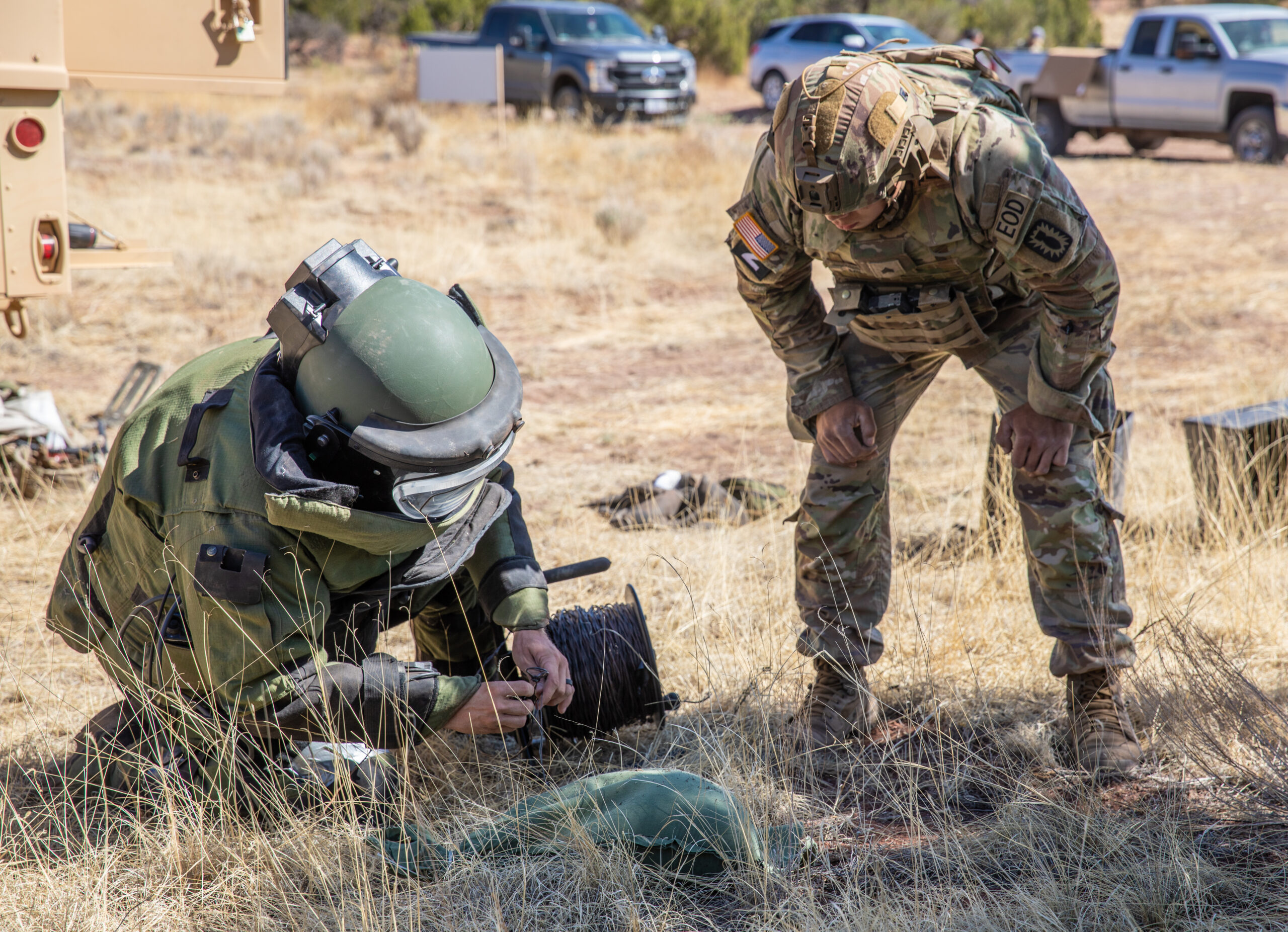 Staff Sgt. Billy McCoy (Left) and Sgt. Micah Miller (right), explosive ordnance disposal (EOD) technicians assigned to 722nd Ordnance Company Airborne (EOD), 192nd Ordnance Battalion (EOD) based out of Fort Bragg, North Carolina, set up electronic demolition in preparation for render safe procedures (RSP) during the EOD Team of the Year (ToY) competition 15-19 May on Fort Carson, Colorado. The Team of the Year competition is where explosive ordnance disposal technicians face off in challenging scenarios and are assessed on fitness, technical and tactical skills and response capabilities. (U.S. Army photo by Sgt. Sharifa Newton)