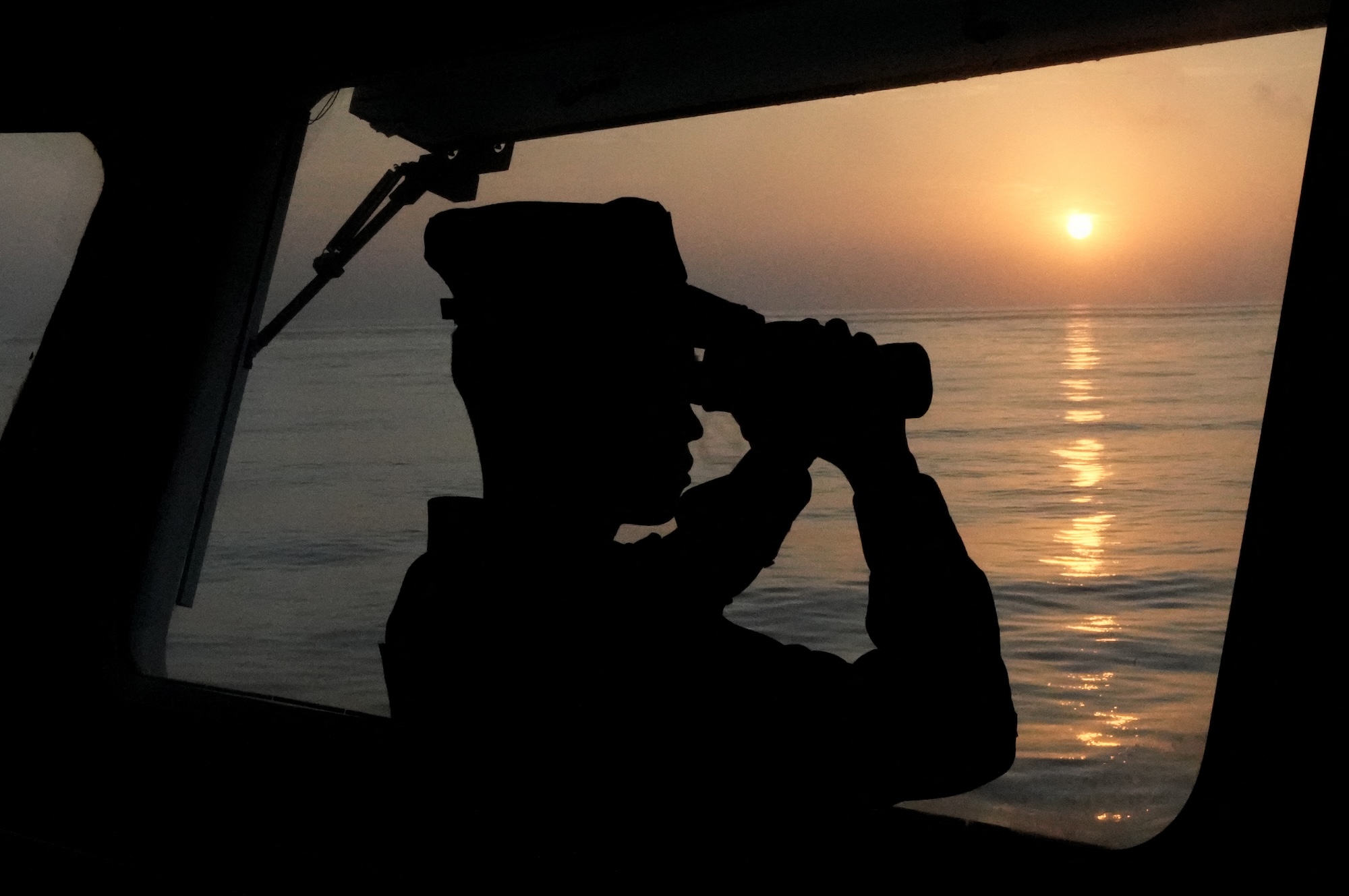 A law enforcer observes on the vessel 