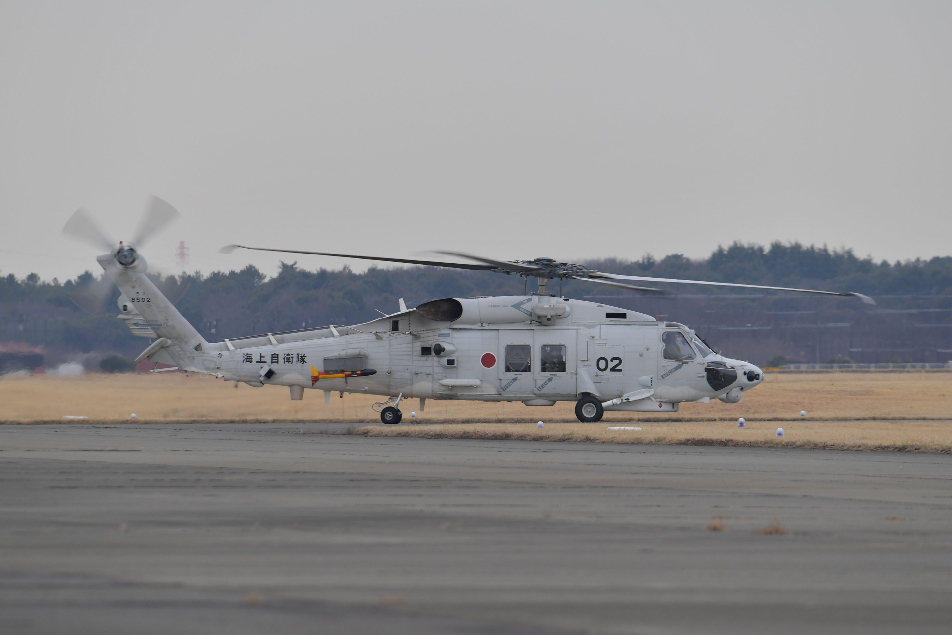 A Mitsubishi SH-60L helicopter