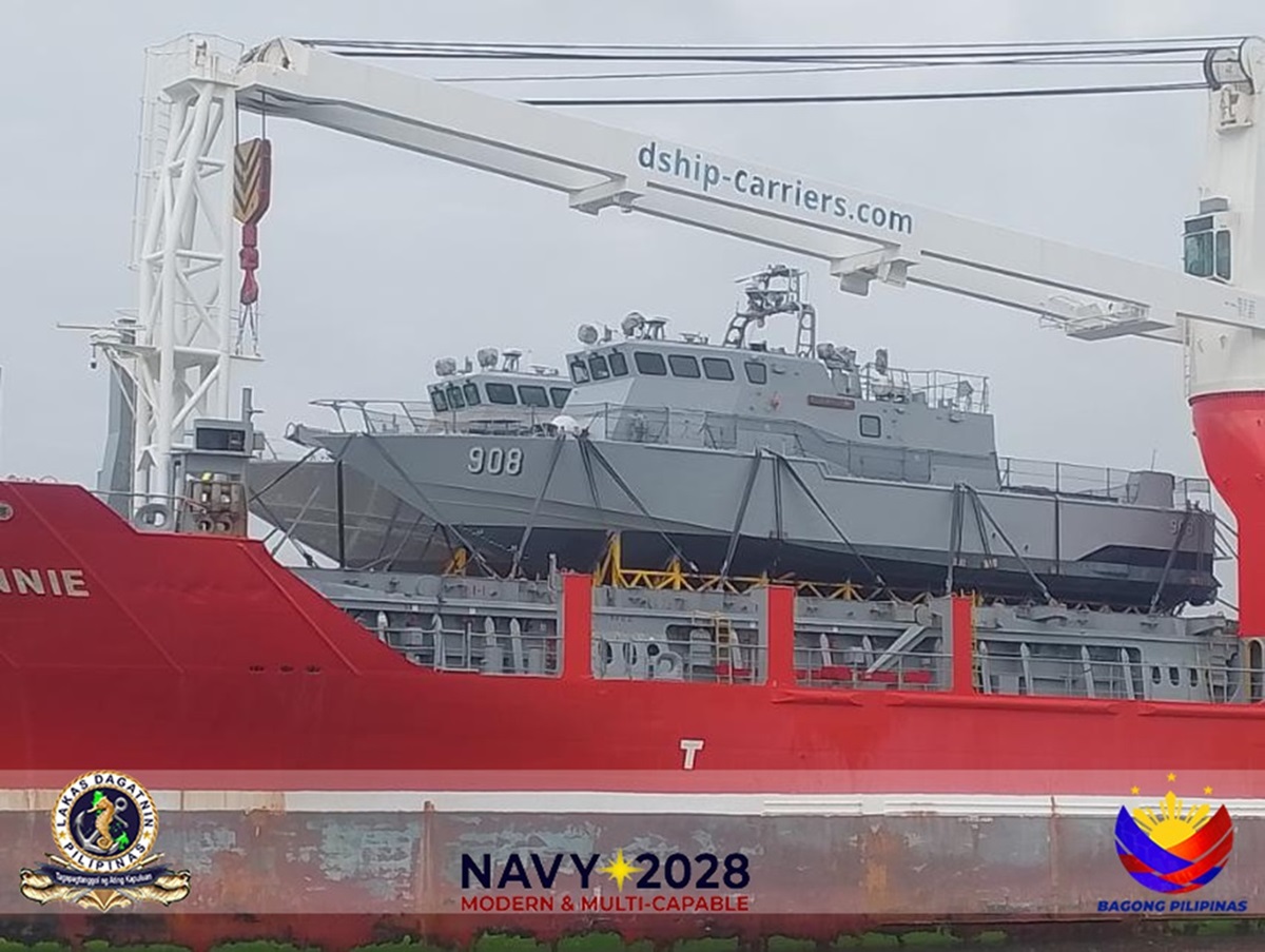 Philippine fast attack interdiction craft PG-908 and and PG-909 aboard a cargo ship